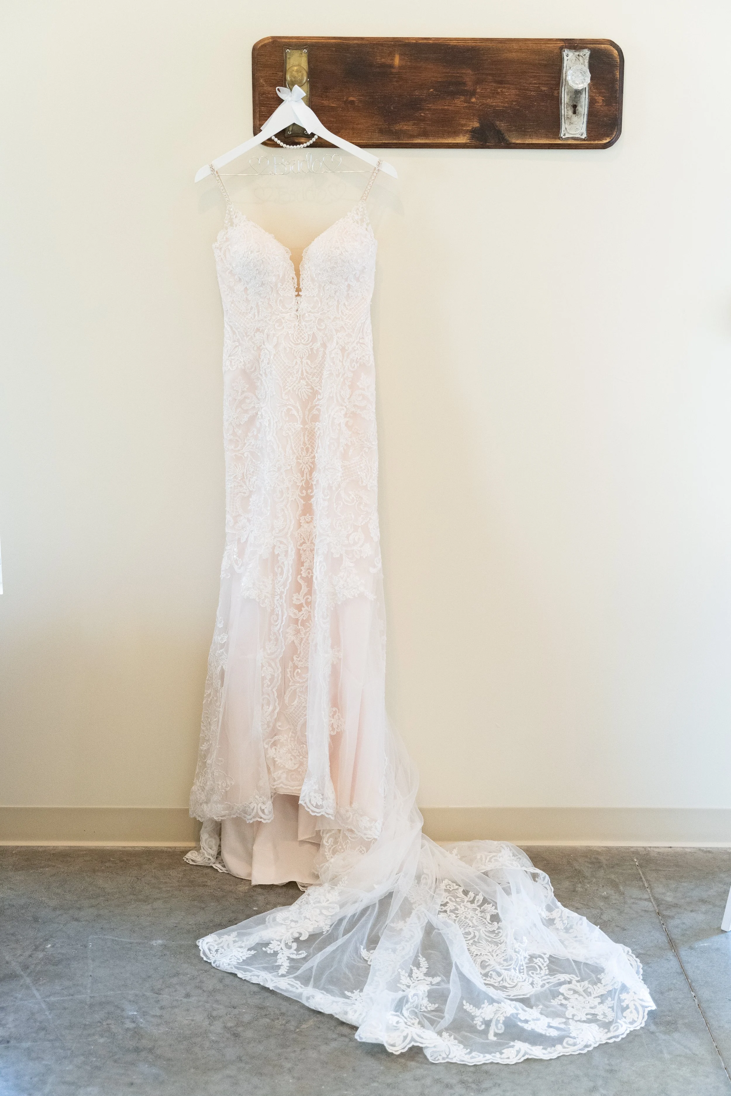 This is a scenic boho rustic view of the inside of the bridal suite at The Magnolia Barn award-winning reception hall outdoor barn wedding venue featuring an exposed brick wall with natural light in Miamisburg at Magnolia Estate. Surrounded by the Gr