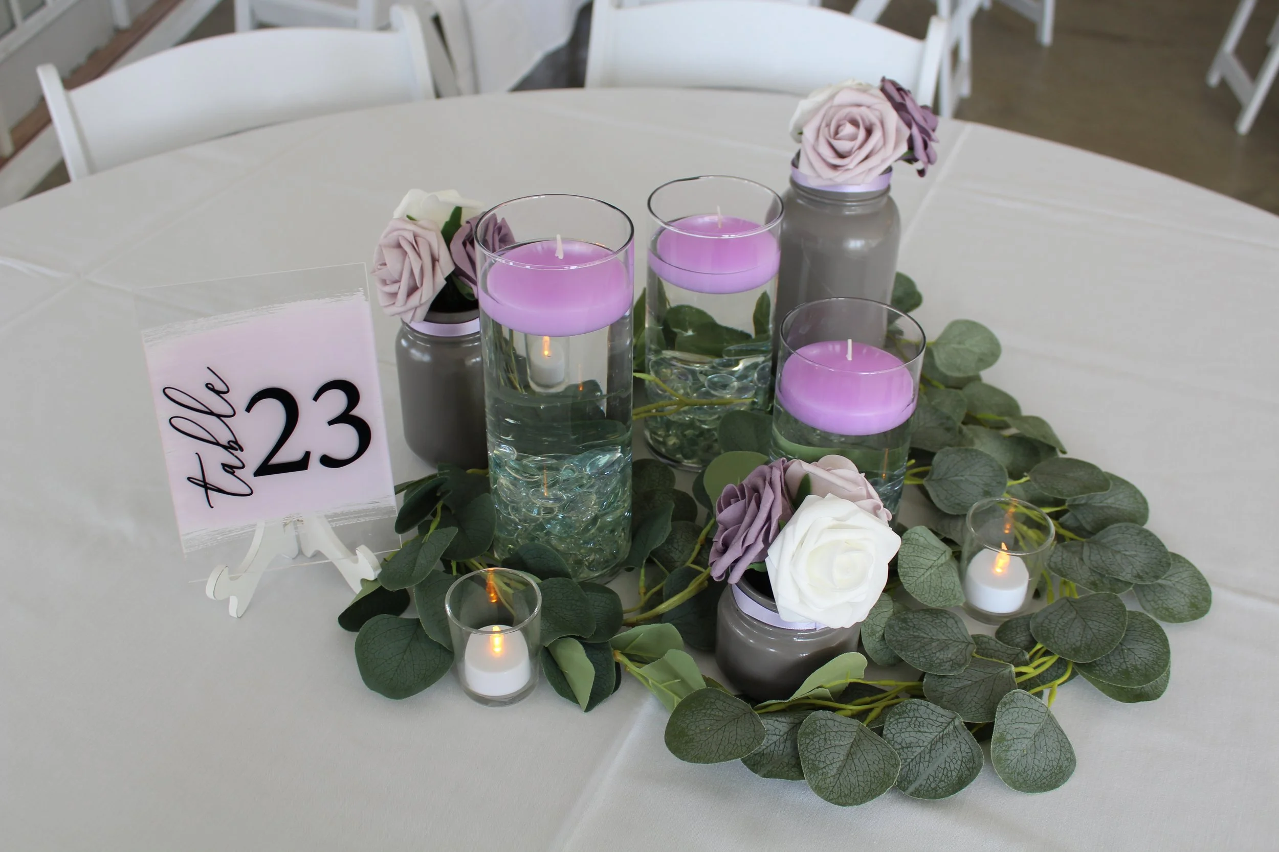 This is a scenic boho rustic view of the inside of The Magnolia Barn award-winning reception hall outdoor barn wedding venue featuring an exposed brick wall with natural light in Miamisburg at Magnolia Estate. Surrounded by the Greater Dayton, Columb