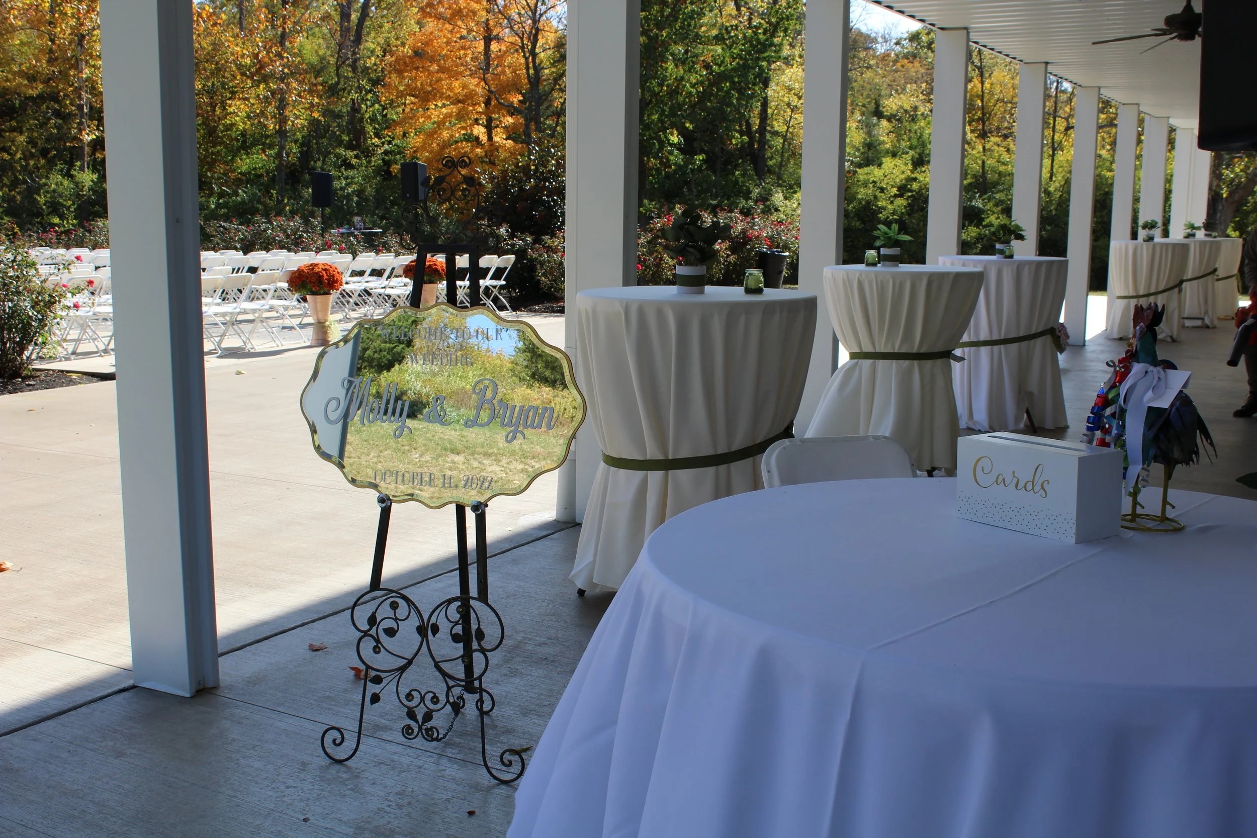 This is a scenic boho elegant rustic view of the back cocktail hour patio of the award-winning reception hall outdoor mansion wedding venue Rosewood Manor in Miamisburg at Magnolia Estate. Surrounded by the Greater Dayton, Columbus, and Cincinnati ar
