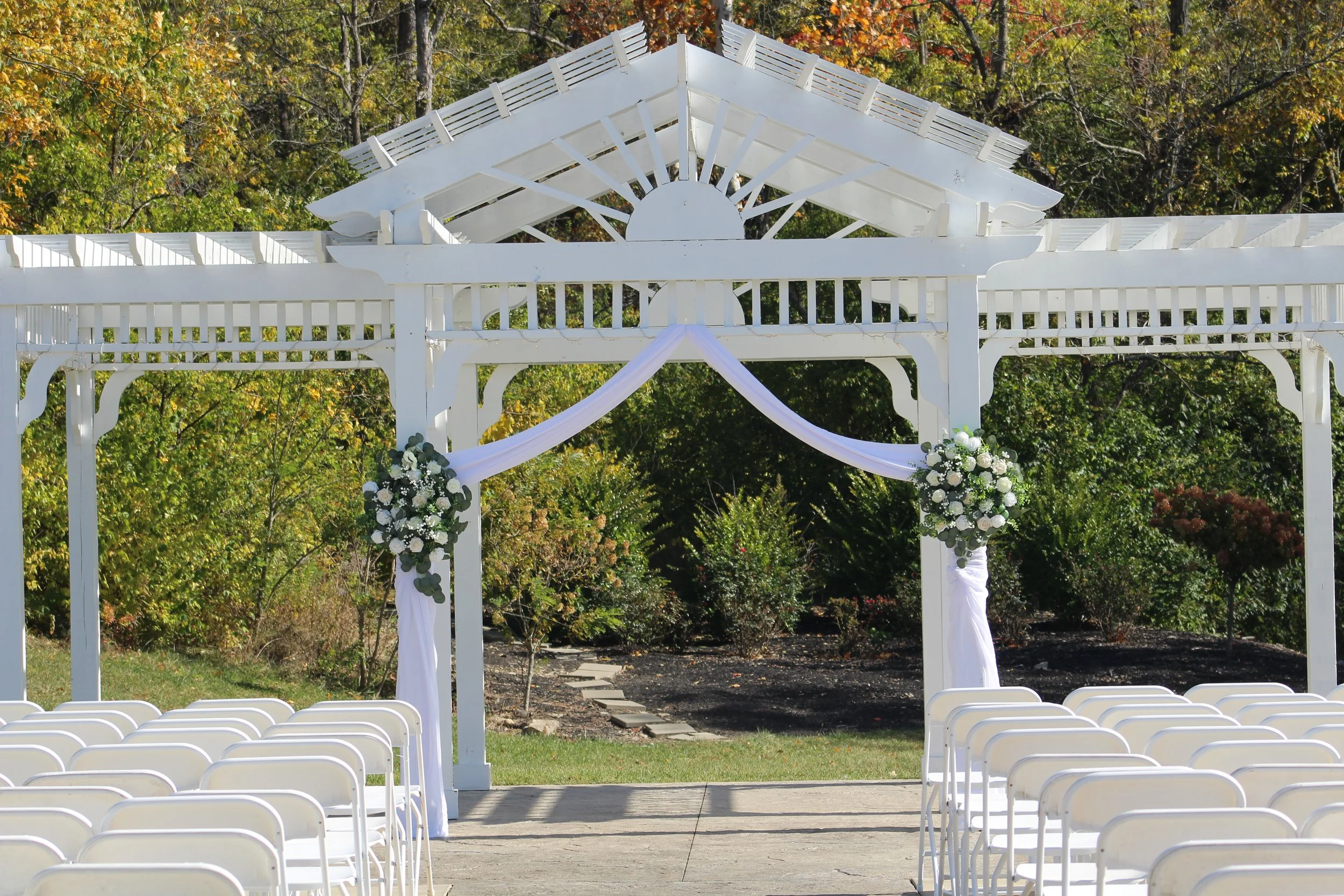 This is a scenic boho elegant rustic view of the ceremony area of the award-winning reception hall outdoor mansion wedding venue Rosewood Manor in Miamisburg at Magnolia Estate. Surrounded by the Greater Dayton, Columbus, and Cincinnati areas. 