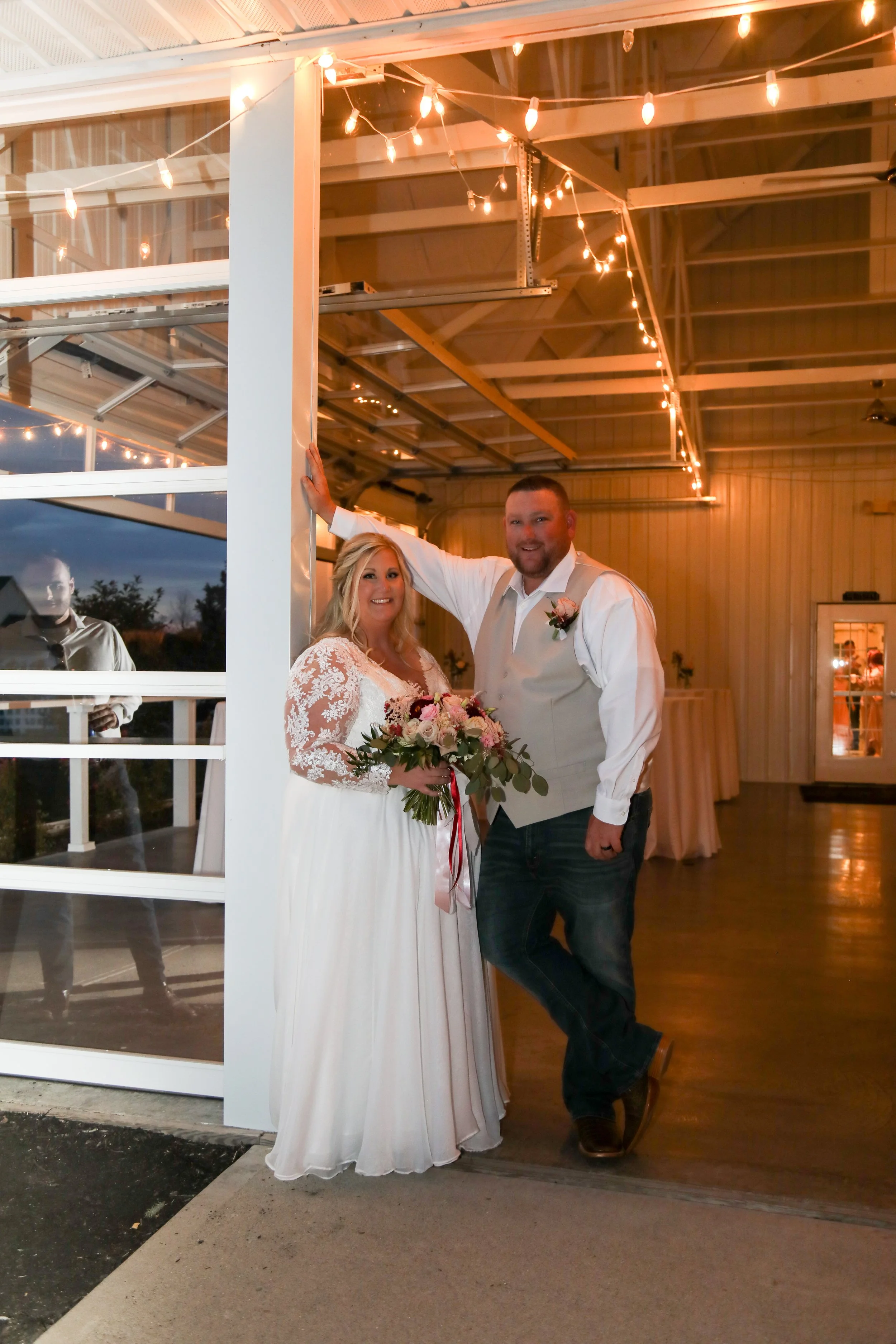 This is a scenic boho rustic view of the inside of The Magnolia Barn award-winning reception hall outdoor barn wedding venue featuring an exposed brick wall with natural light in Miamisburg at Magnolia Estate. Surrounded by the Greater Dayton, Columb