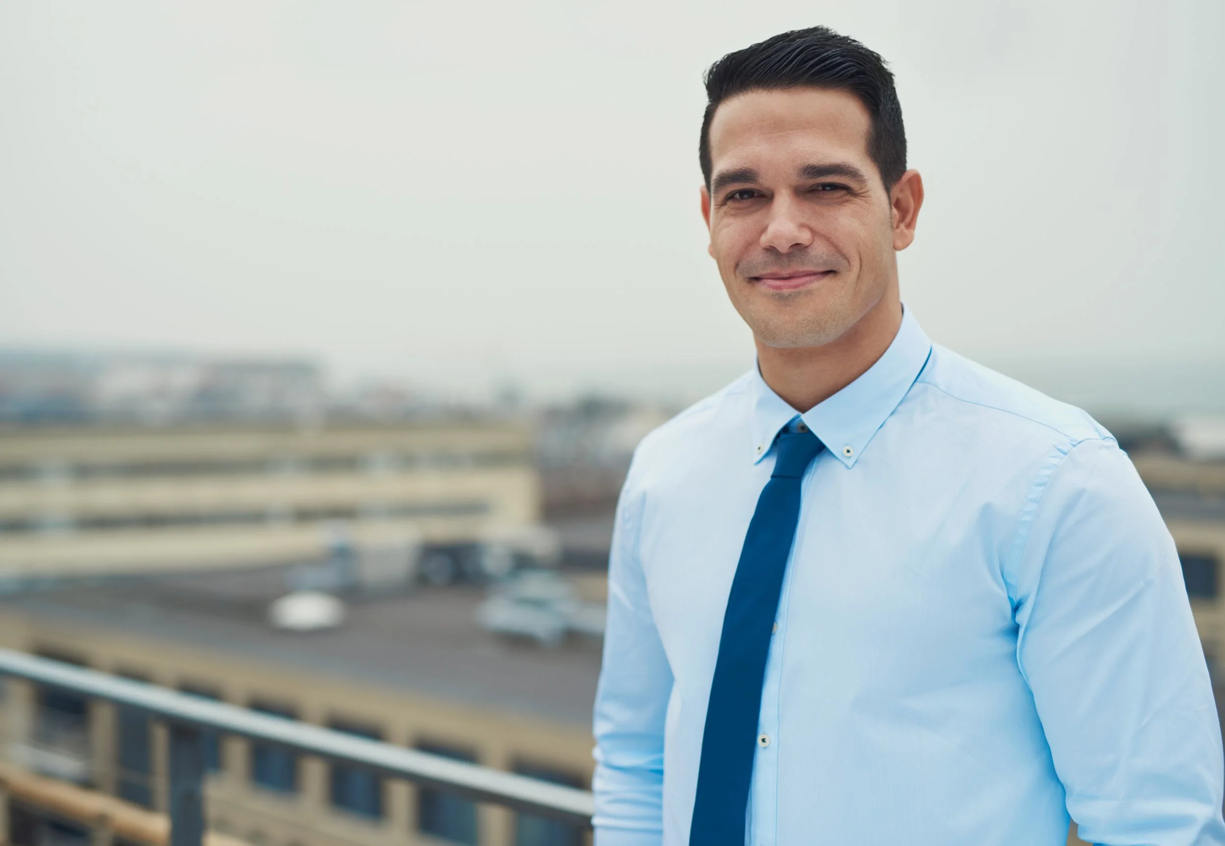 smiling-relaxed-hispanic-businessman-2021-08-26-17-26-56-utc.jpg