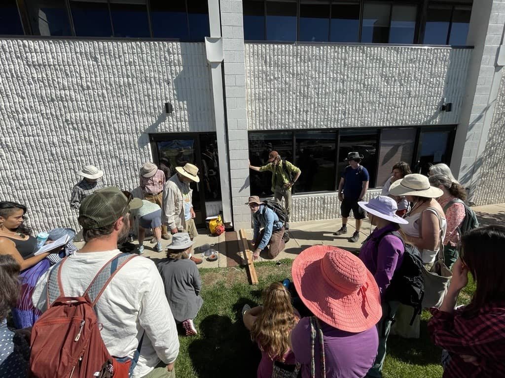   Brad Lancaster (Author, Rainwater Planting Pioneer) demonstrating how to construct a bunyip water level outside the Junkyard Social Club.  