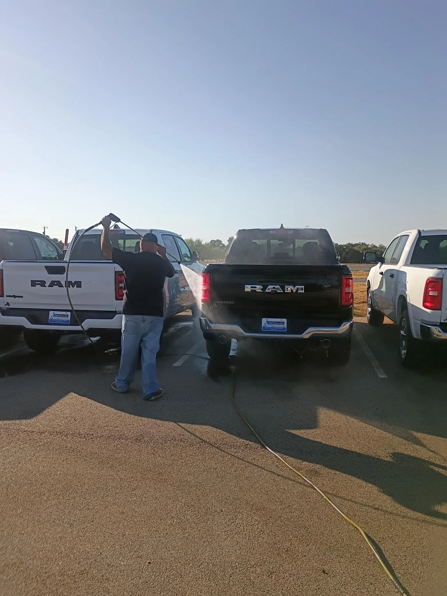 Pickup truck fleet being professionally washed by American Mobile Wash