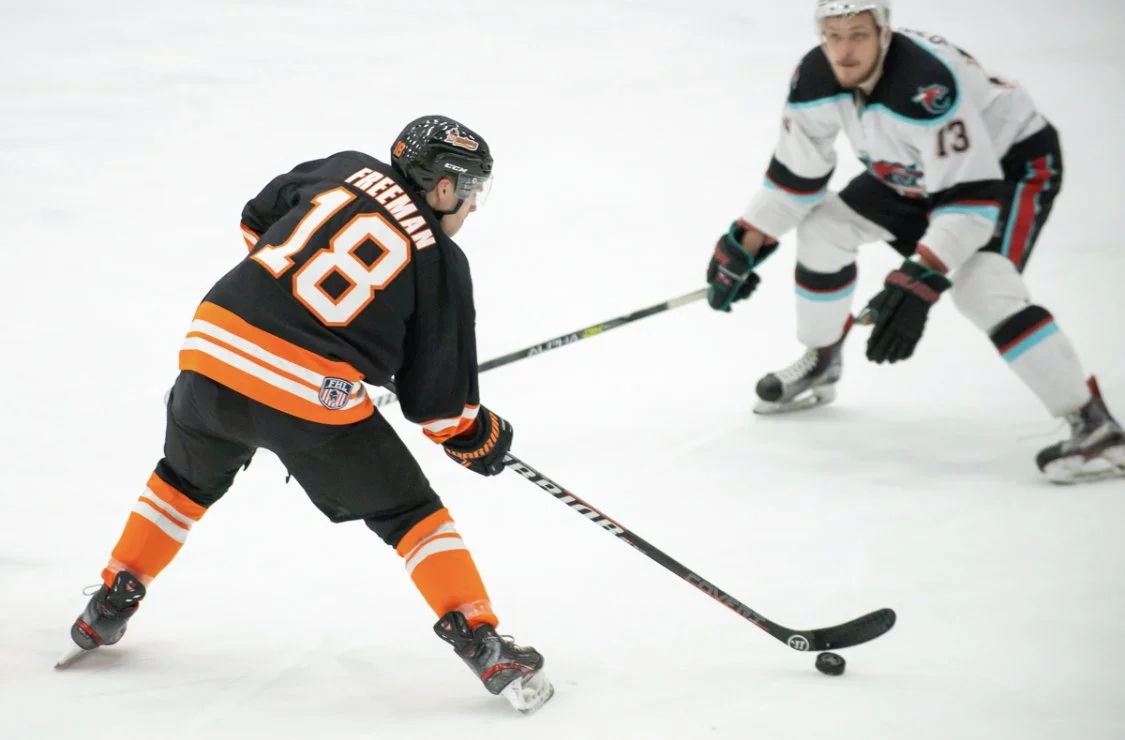 Coach Tommy Freeman playing professional hockey