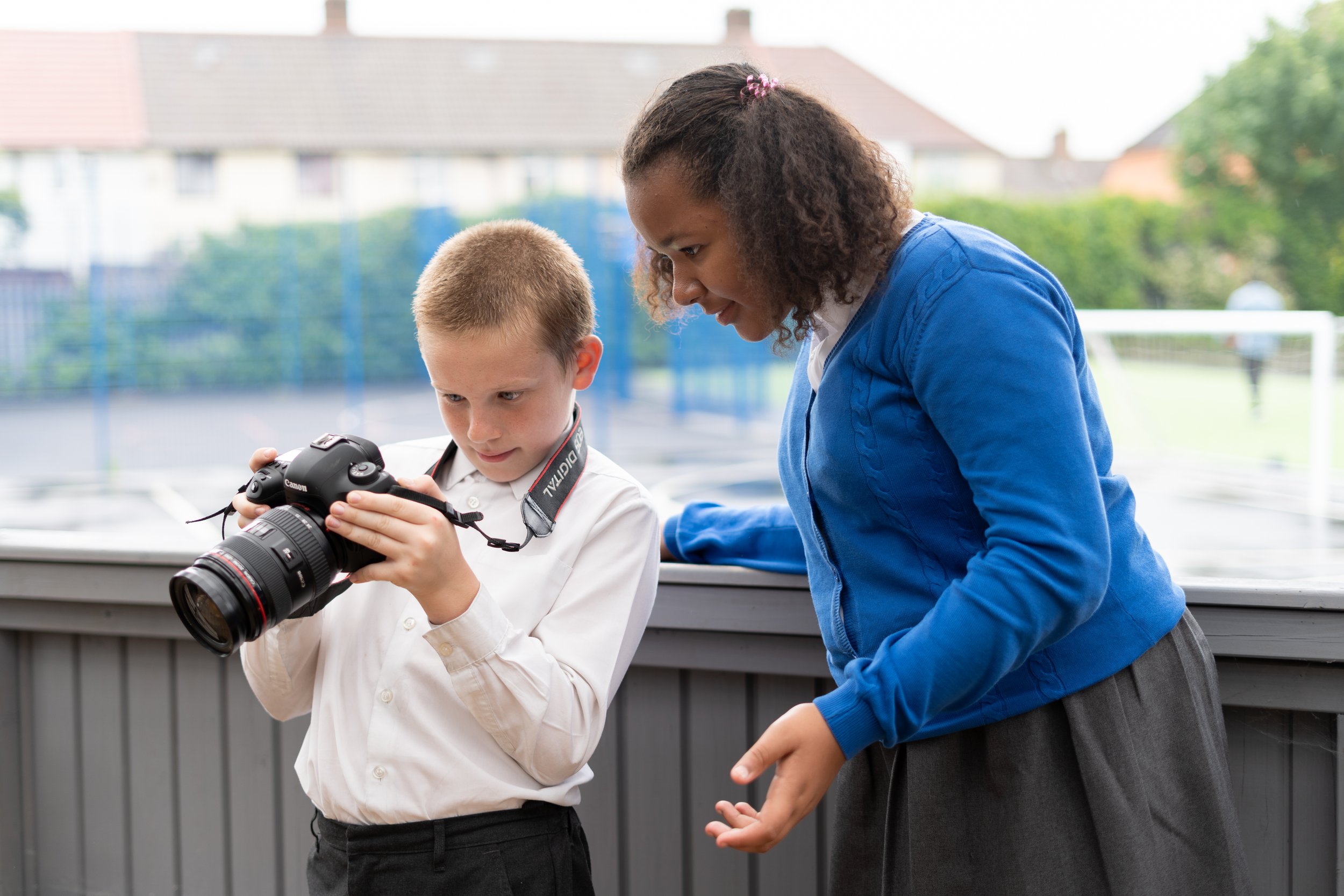 Two students taking photos