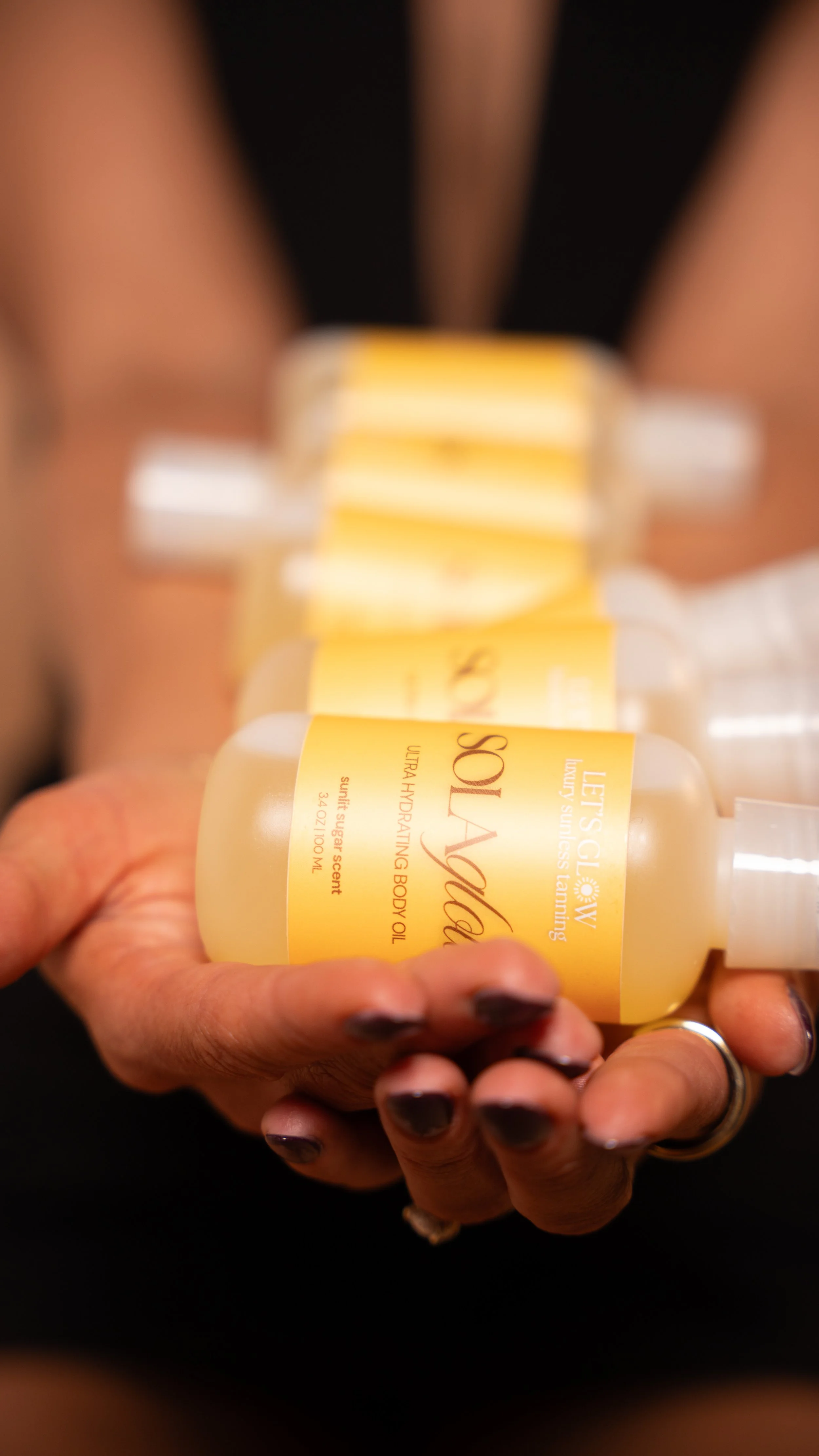 Let's Glow sola glow body oil is best for extending the life of a spray tan and keeping a healthy spray tan glow