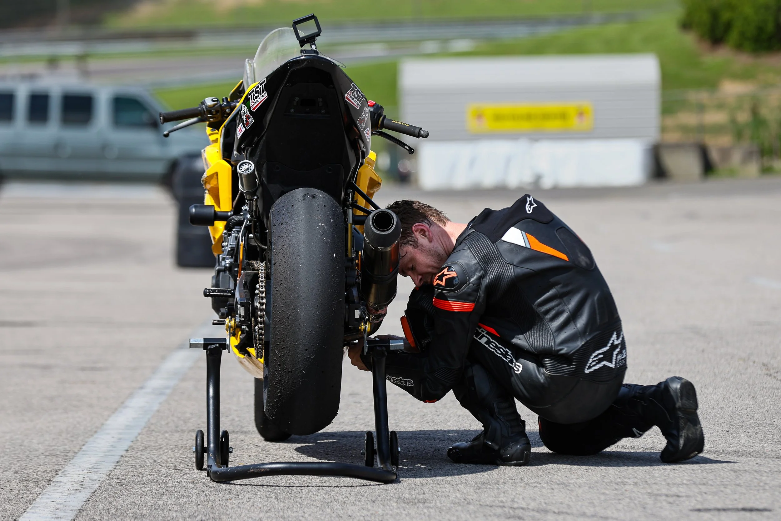 A WERA rider makes last minute adjustments to his bike in the paddock at Barber Motorsports Park