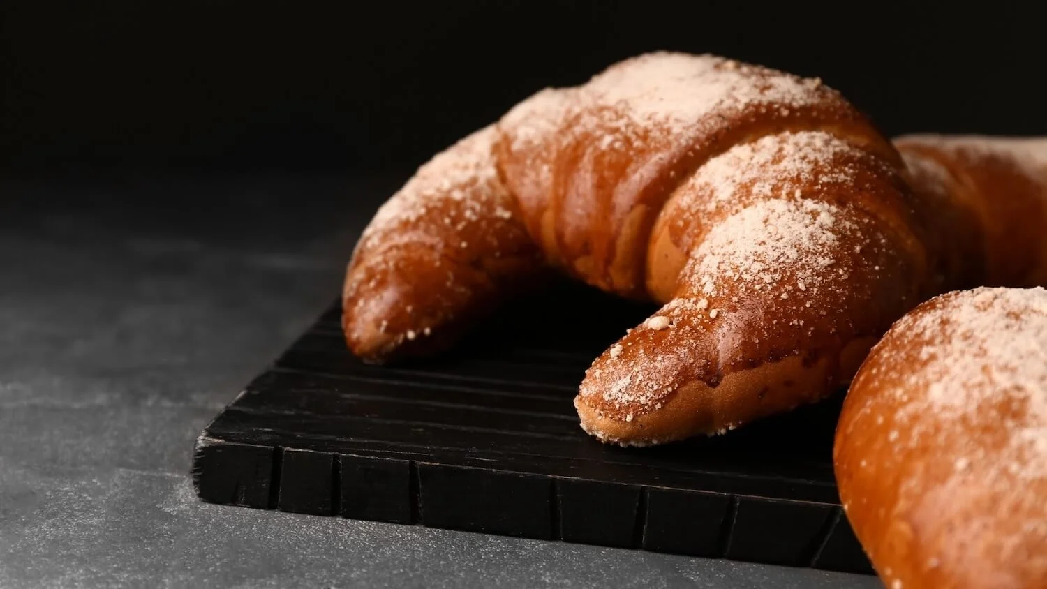 2026 Simple Home Favorites (Flour-dusted crescent rolls on black board)