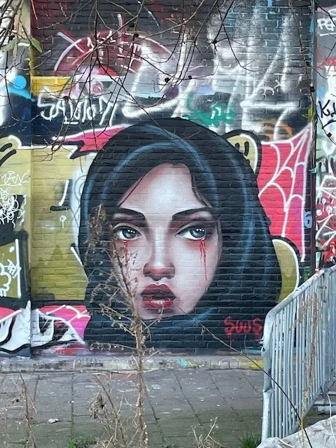 NDSM graffiti - girl with blood tears.jpeg