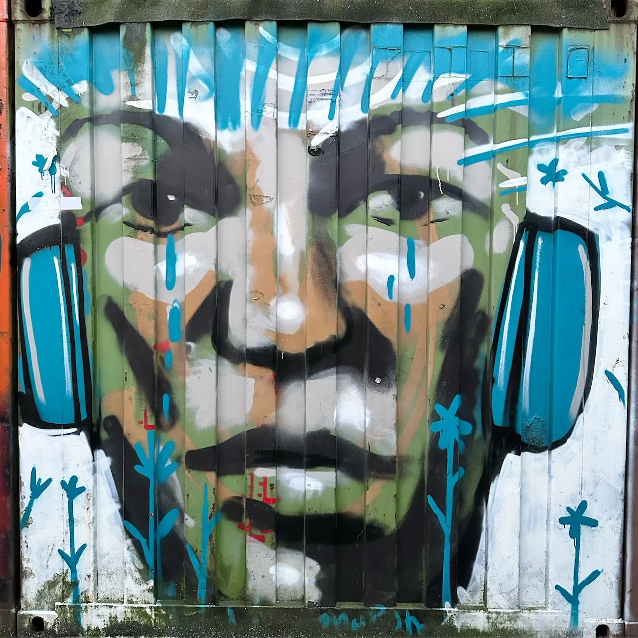 Graffiti NDSM - boy with headphone and tears.JPG