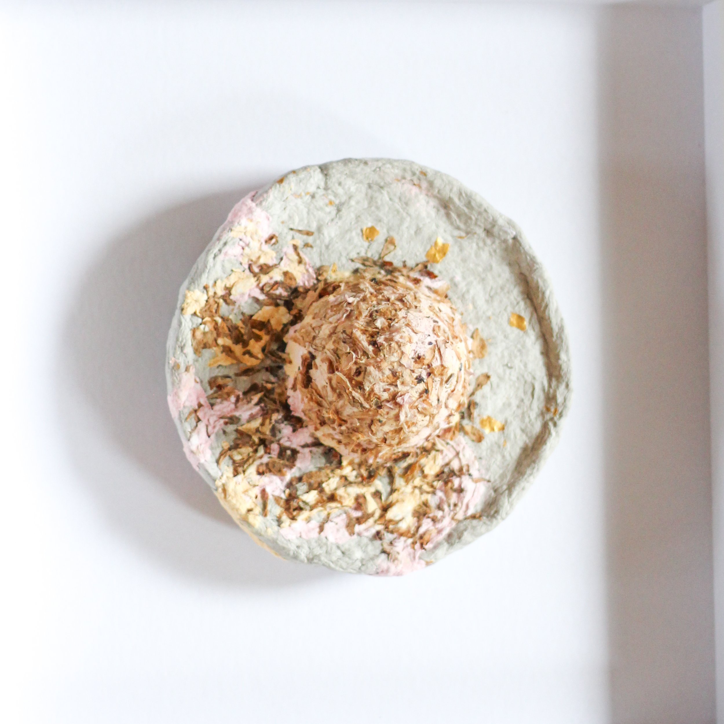 all around is stone, all is soft inside – paper-mâché and cherry blossoms