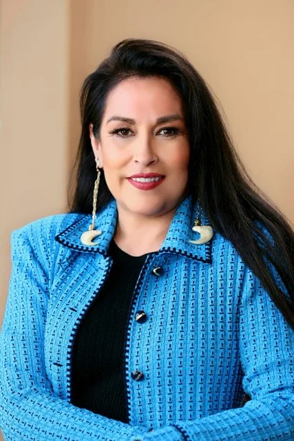 Jhane Myers blue headshot 2_2023 x.jpeg