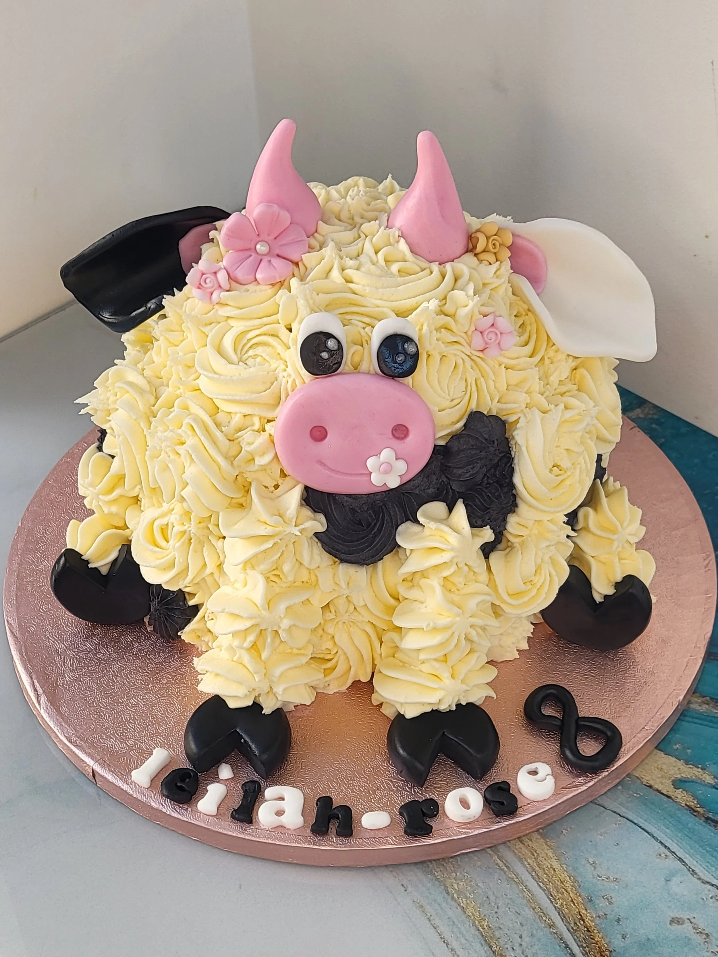 The cow cake decorated with buttercream.