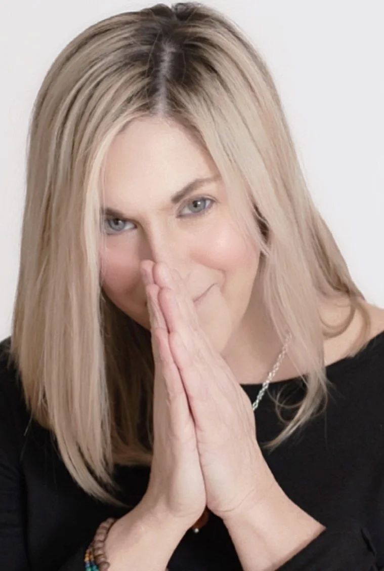 jennifer mello with prayer hands to face