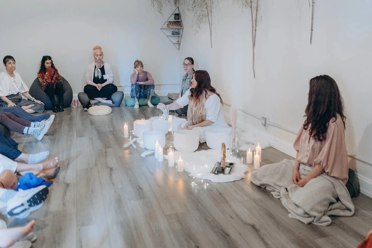 Spiritual entrepreneur hosting a community sound bath event after building brand and marketing systems with Own Your Alchemy.
