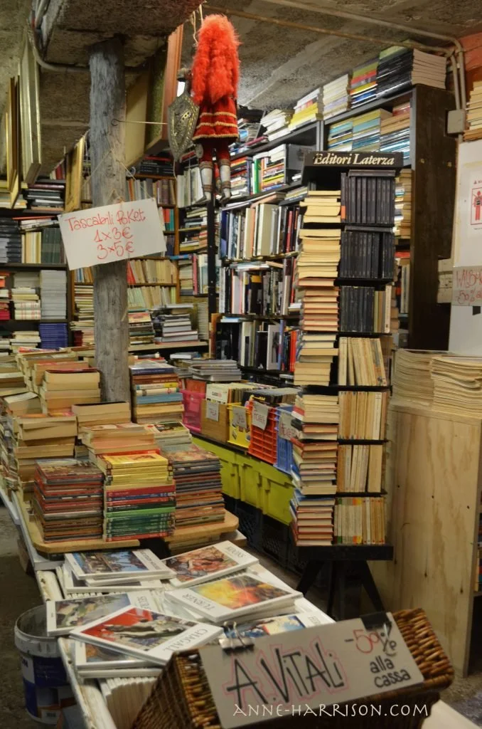 Hundreds of book piled in a bookshop