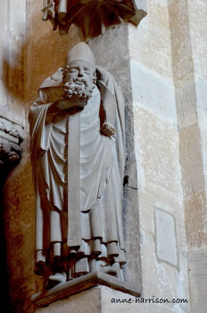 A statue in Bamberg cathedral of a decapitated bishop holding his head