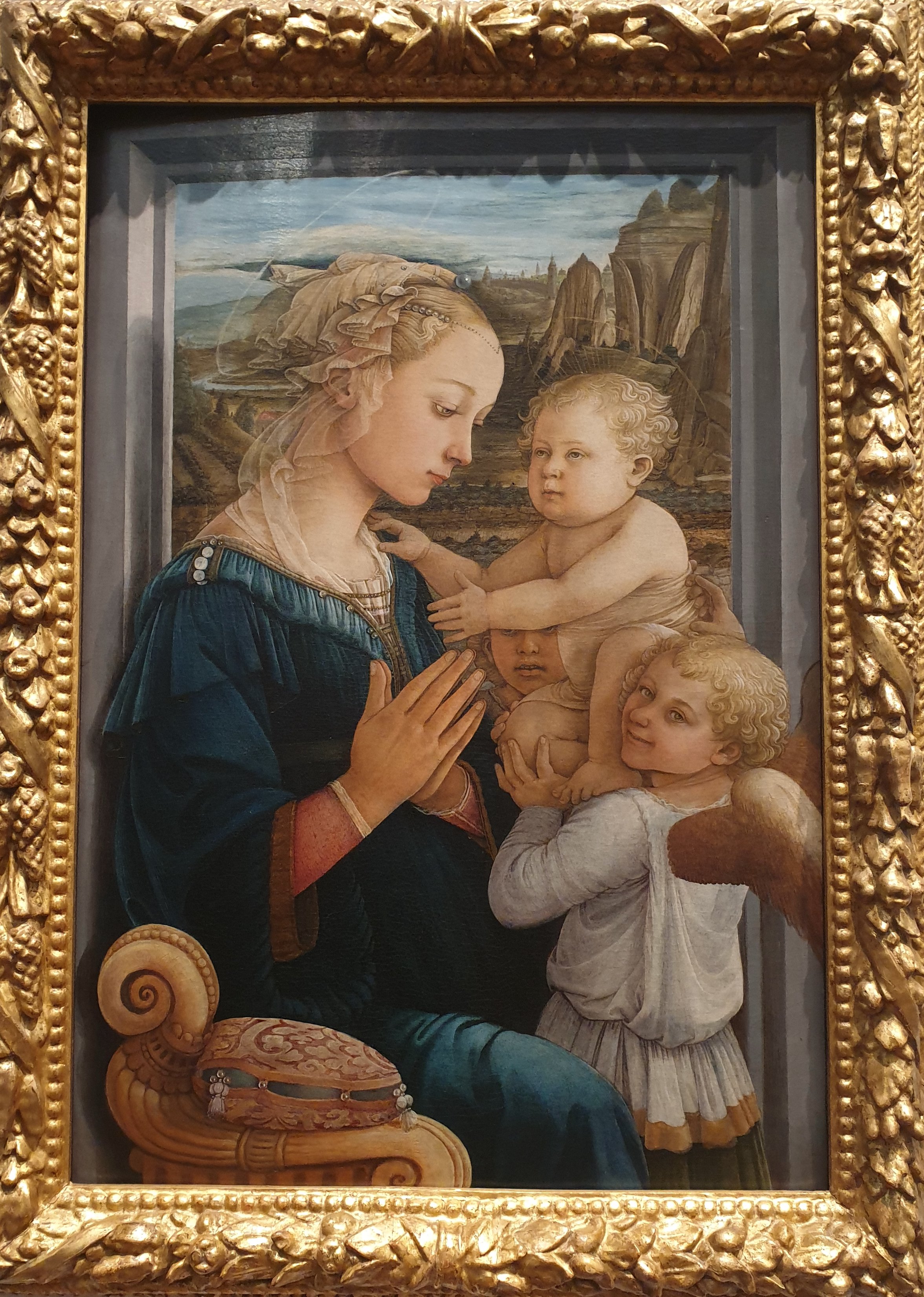 A photograph of Filippo Lippi's Madonna and Child. The painting is in an ornate gold frame.