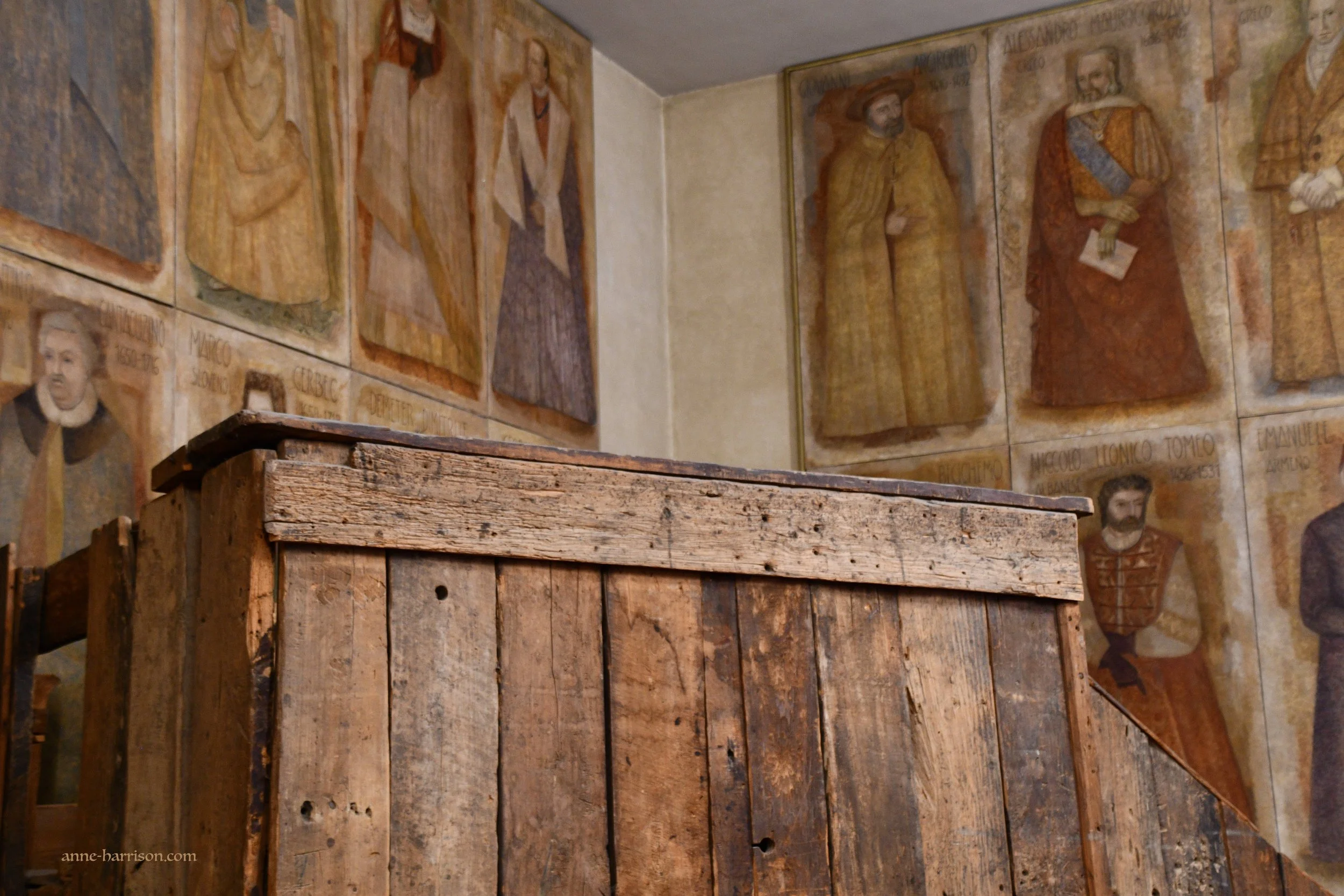 A wooden pulpit once used by Galileo. It's surrounded by frescos