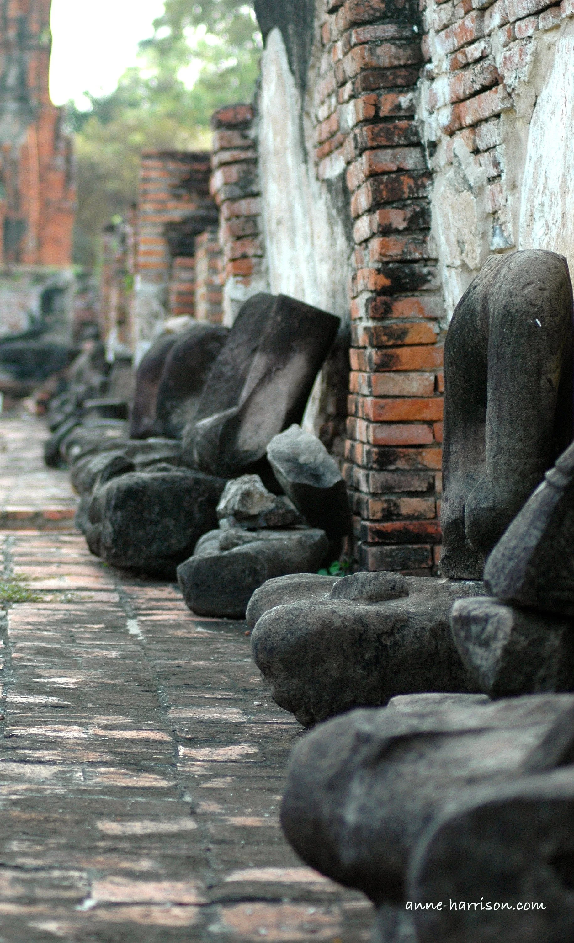 A row of headless buddhas