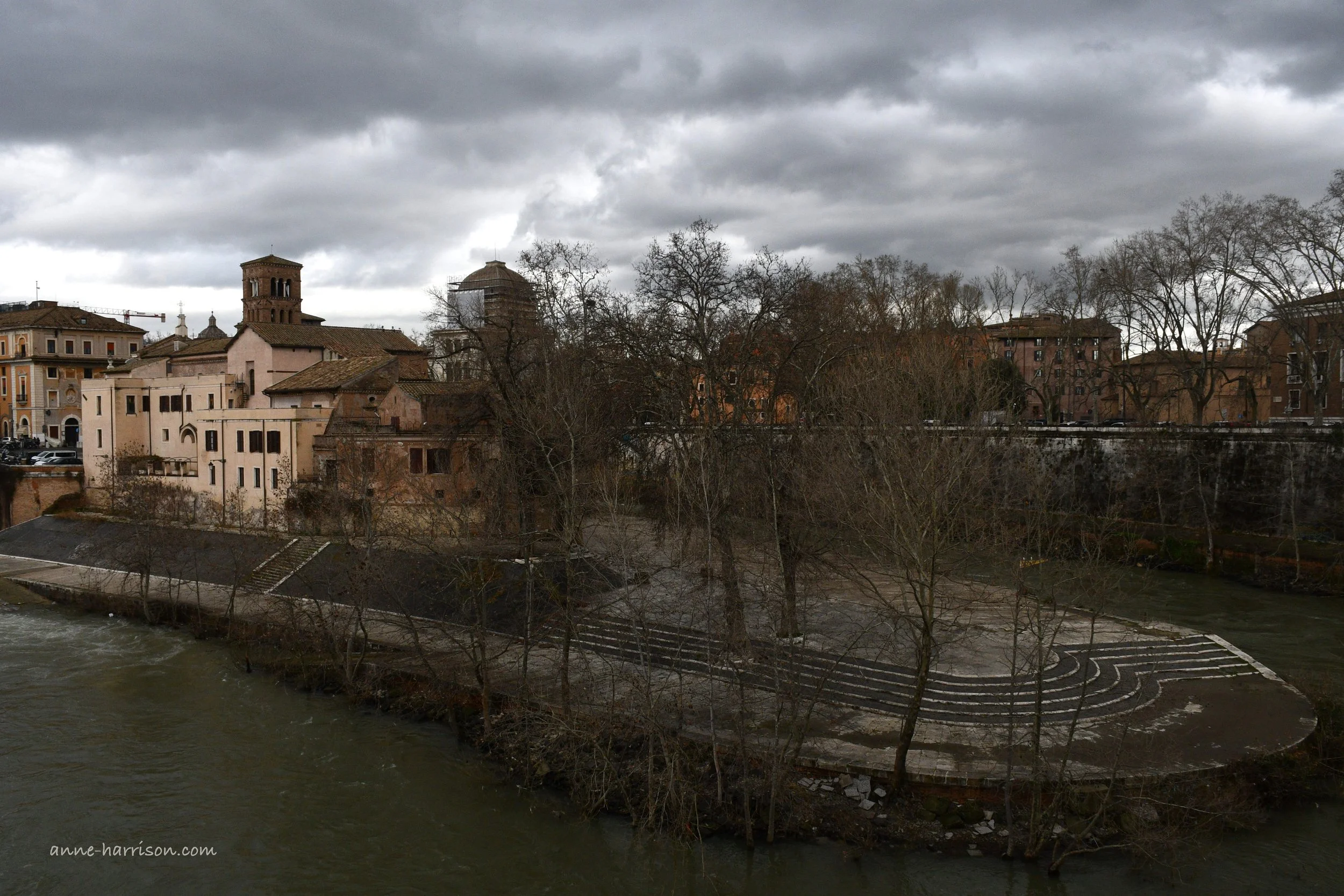 The Tiber Island, seen from the front, or 'prow'. The sky is overcast.