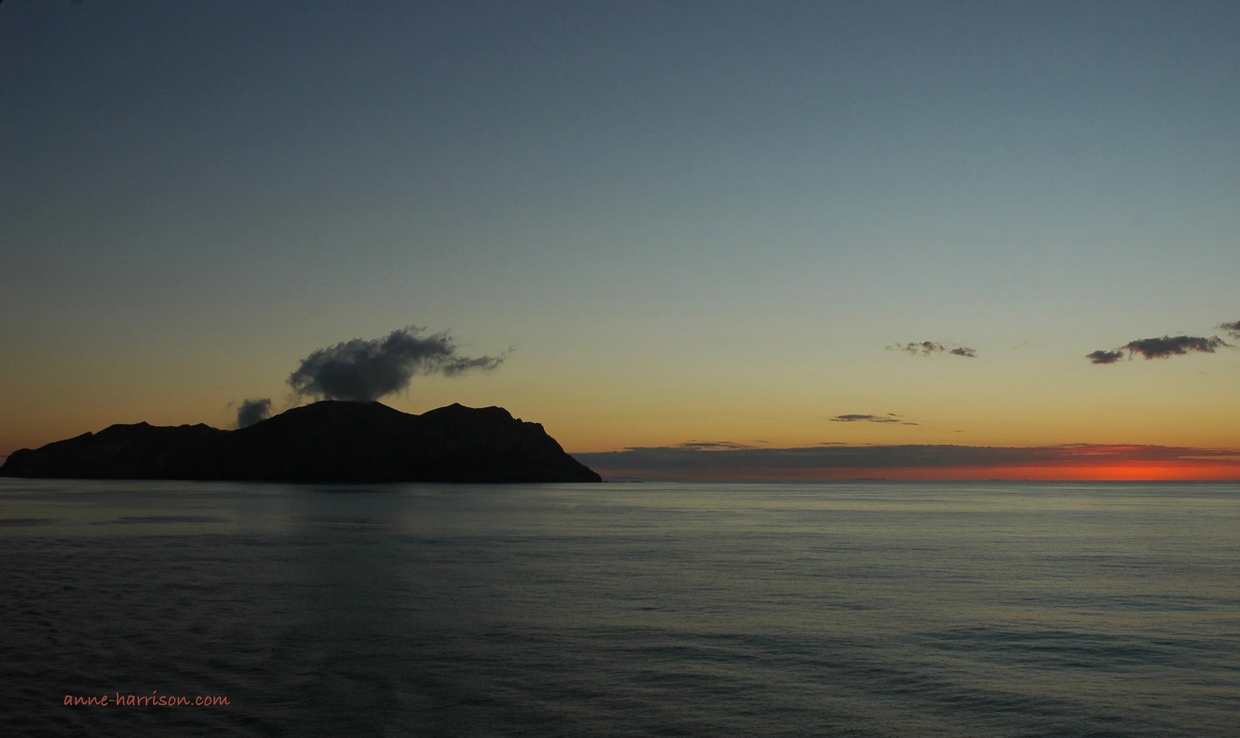 Smoke rising from Te Puia o Whakaari at sunset