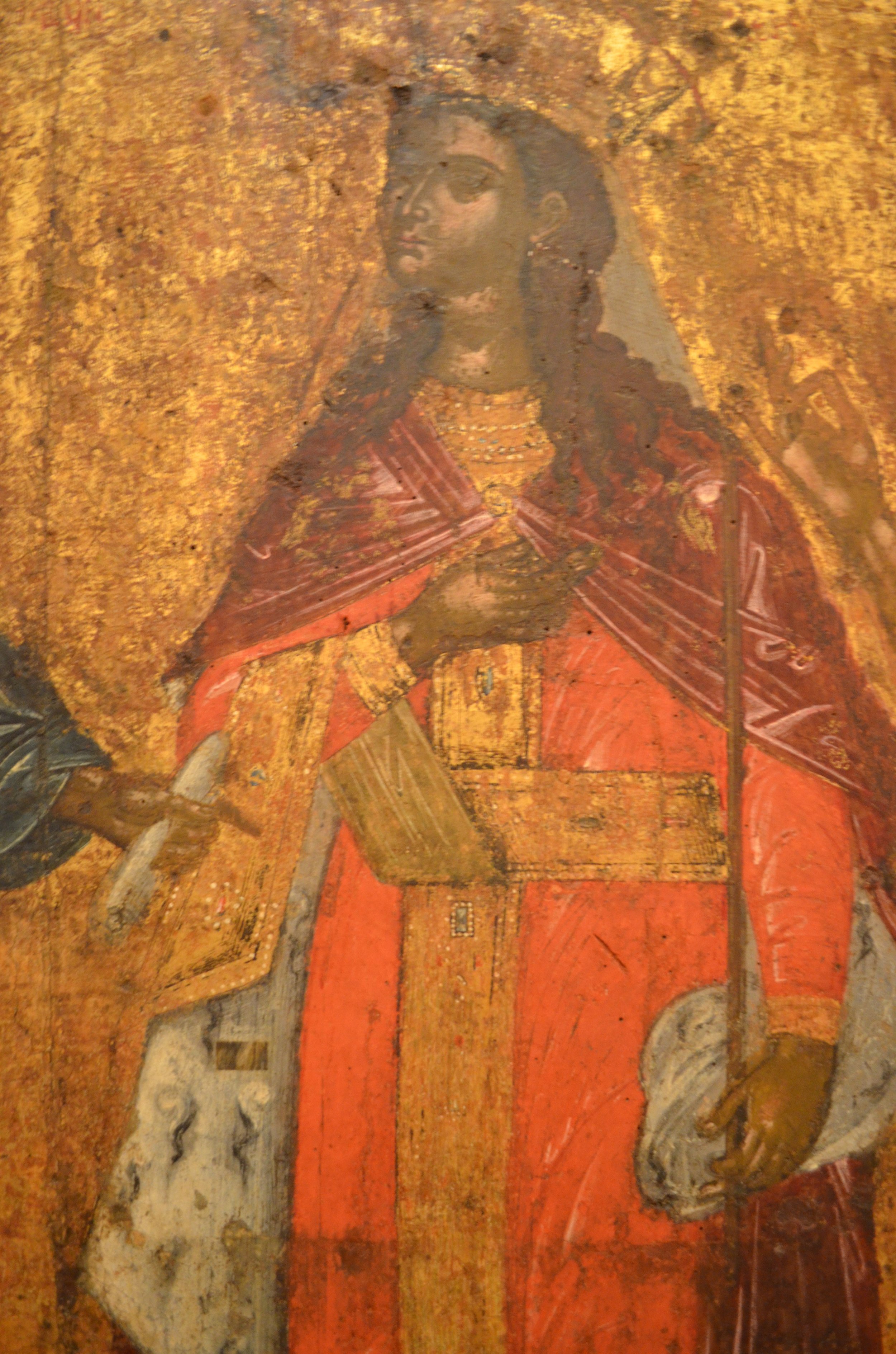  An orthodox icon of our lady in St Spyridon, Corfu. She is clothed in red and gold, and bears a staff. 
