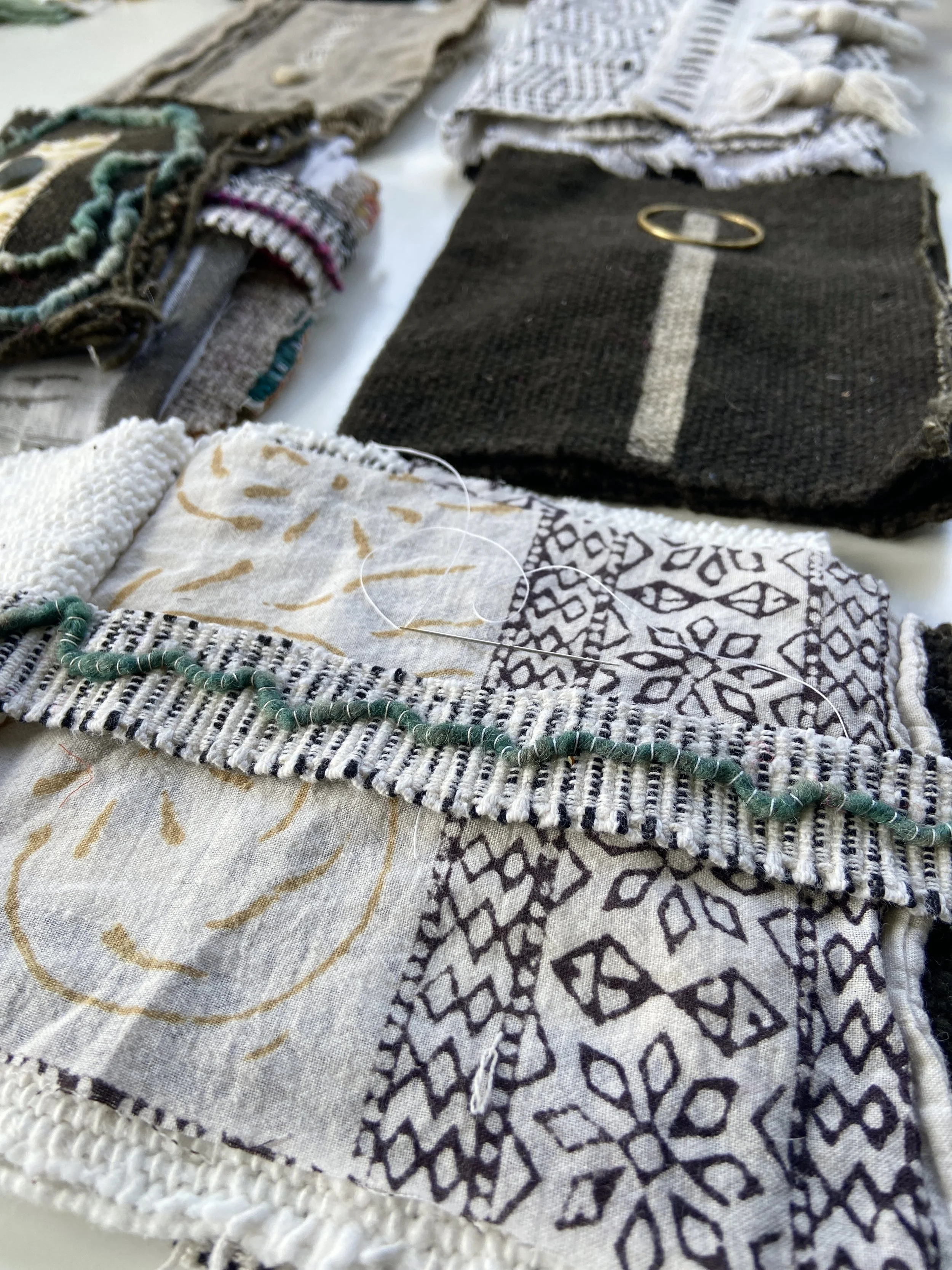 Rustic, contemplative mixed media textile books made by mixed media artist, Emma Freeman using vintage global textiles including mud cloth from Mali in Africa, batik fabric from India, vintage kantha cloth from India, wool yarn from a Peruvian frazad
