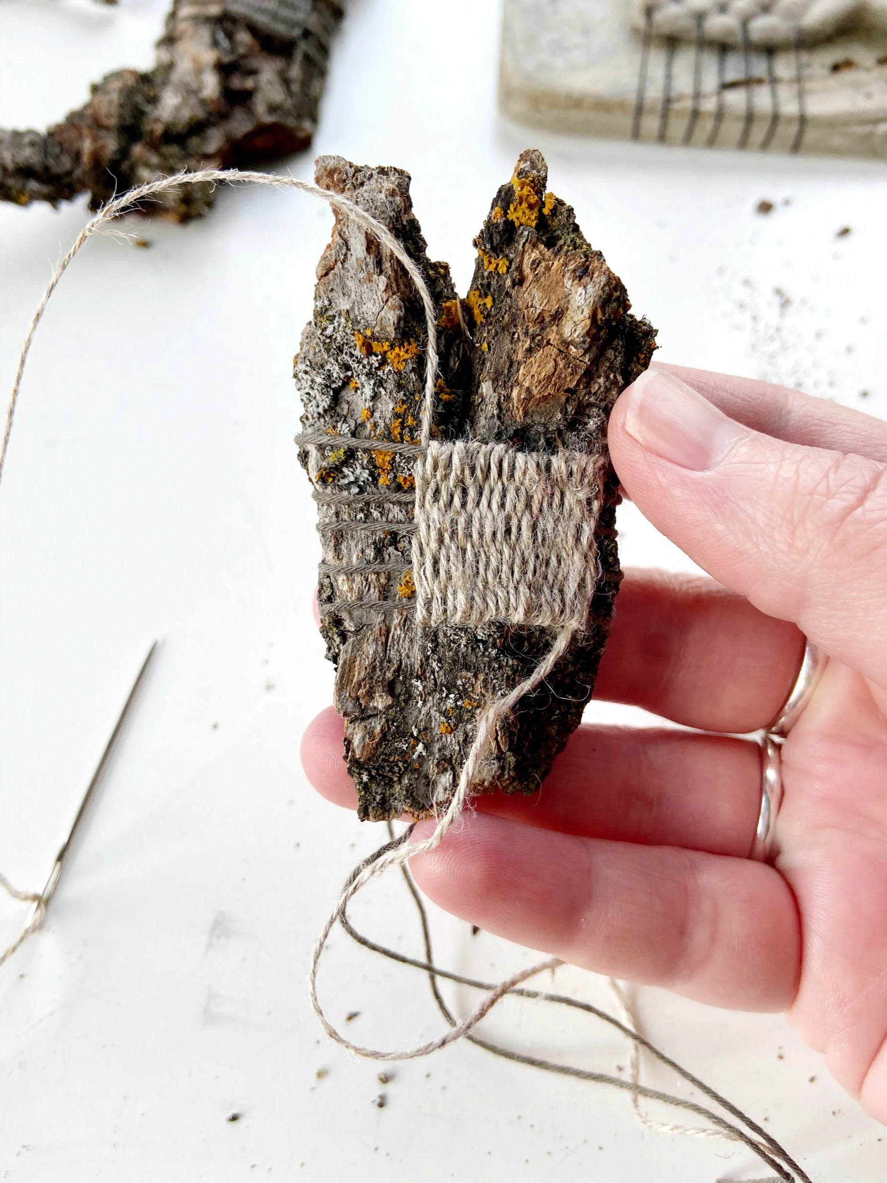 Weaving with nature by Emma Freeman of Deep Rooted Healing, weaving with found tree bark, heart shaped art, eco artist, Zen art, Buddhist artist, art as meditation, found nature art, hand spun nettle yarn, Japanese sashiko thread dyed with persimmons