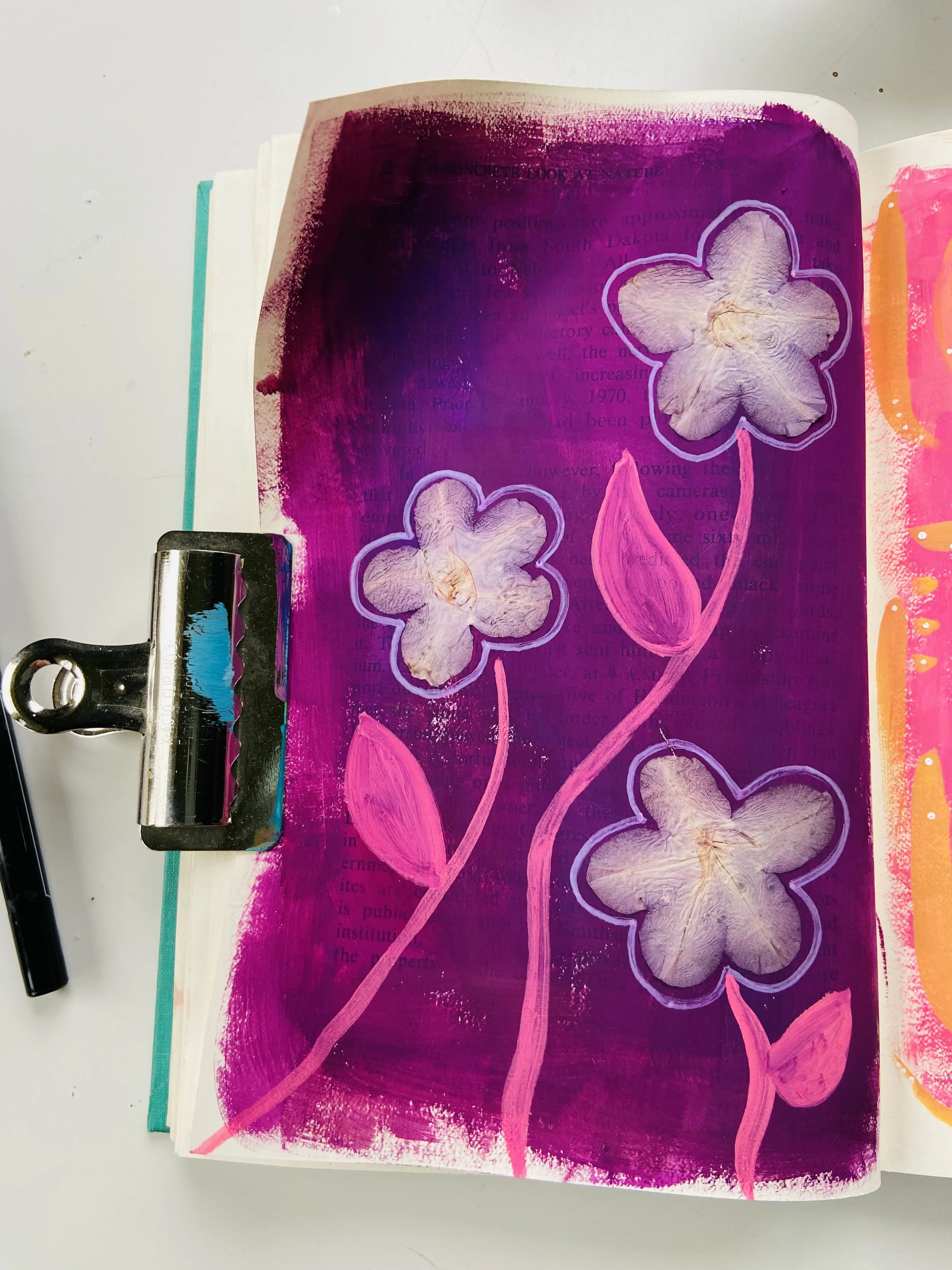  Intuitive floral art journal painting by Emma Freeman of Wings of Light which she created with purple and pink gouache and acrylic paints and pressed flowers from her mom’s garden 