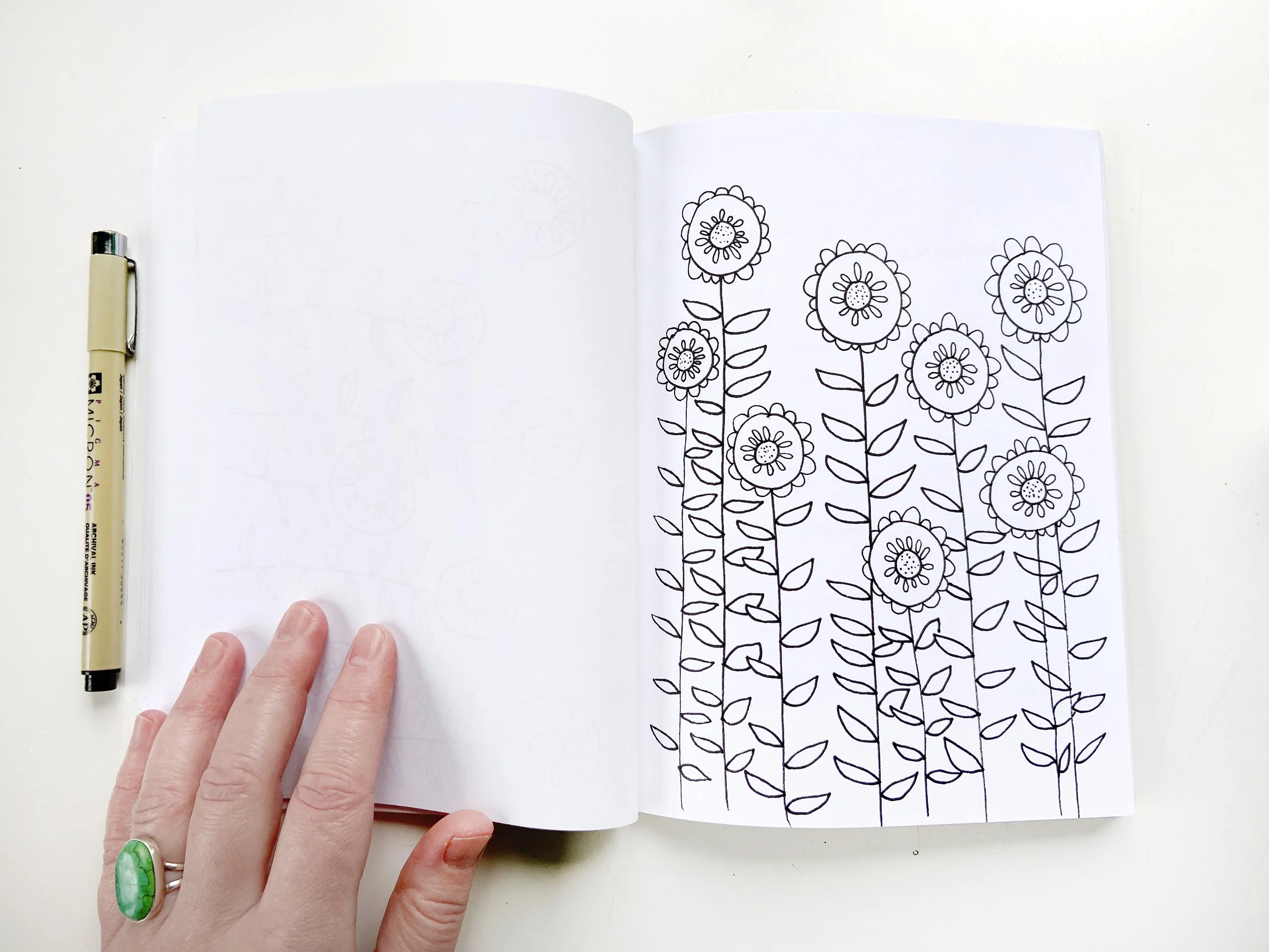 Flowers with Pen and Hand.jpeg