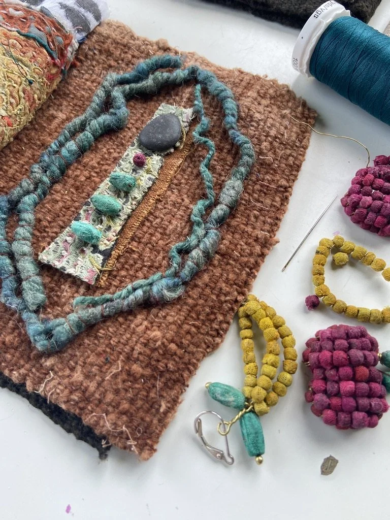 Rustic, contemplative mixed media textile meditation books made by mixed media artist, Emma Freeman using vintage global textiles including mud cloth from Mali in Africa, batik fabric from India, vintage kantha cloth from India, wool yarn from a Peru