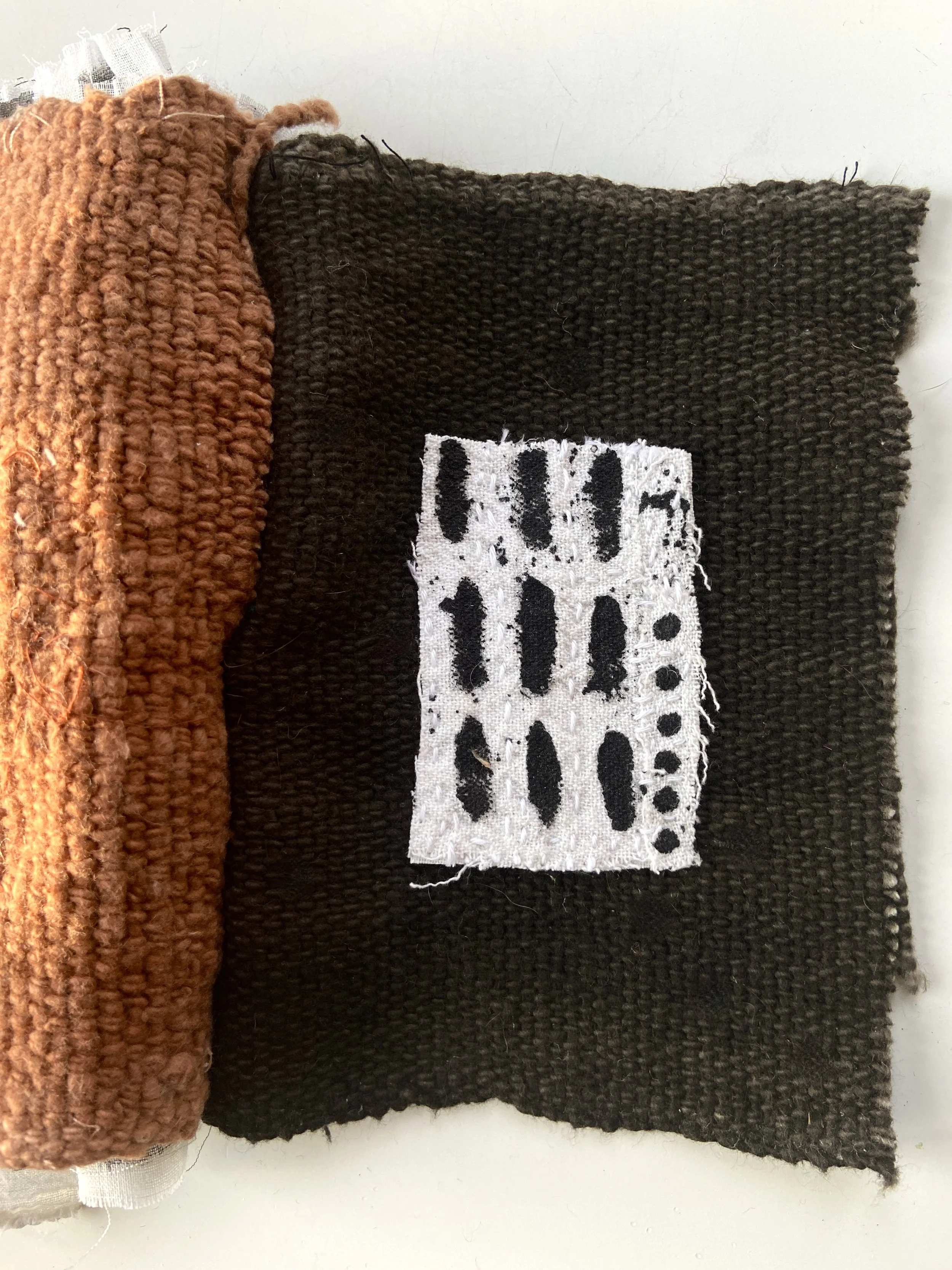 Rustic, contemplative mixed media textile books made by mixed media artist, Emma Freeman using vintage global textiles including mud cloth from Mali in Africa, batik fabric from India, vintage kantha cloth from India, wool yarn from a Peruvian frazad