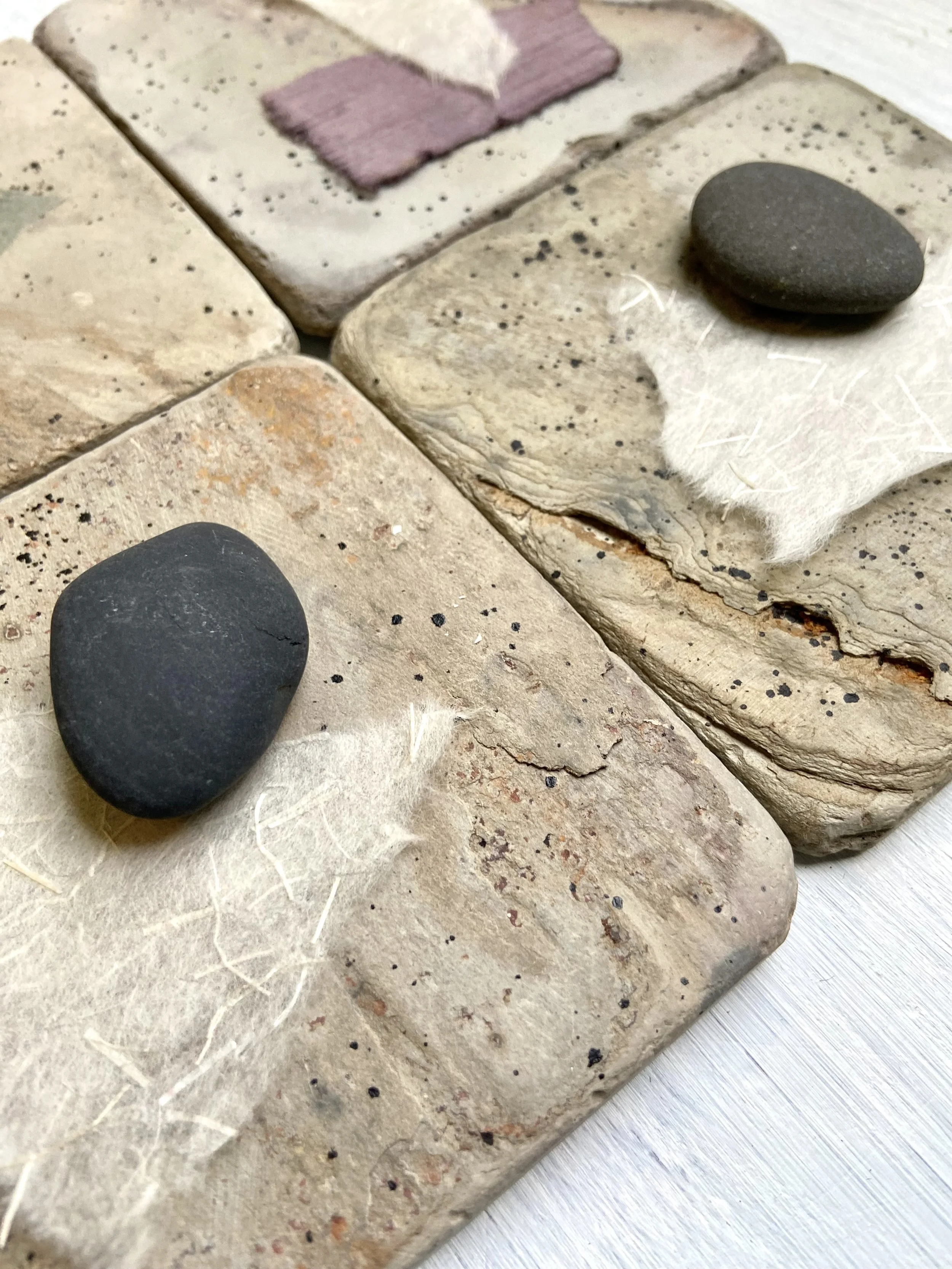Zen contemplative assemblages of repurposed stone tiles, handmade paper, gathered stones, nature connected art, meditative art, contemplative art, peaceful art, mixed media artist in Wisconsin, Emma Freeman Art, textile artist, art as spiritual pract