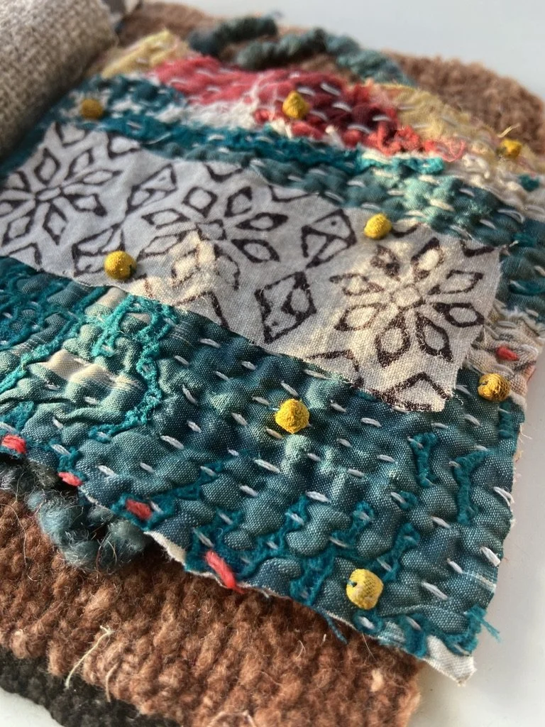 Rustic, contemplative mixed media textile books made by mixed media artist, Emma Freeman using vintage global textiles including mud cloth from Mali in Africa, batik and block printed fabric from India, vintage kantha cloth from India, wool yarn from
