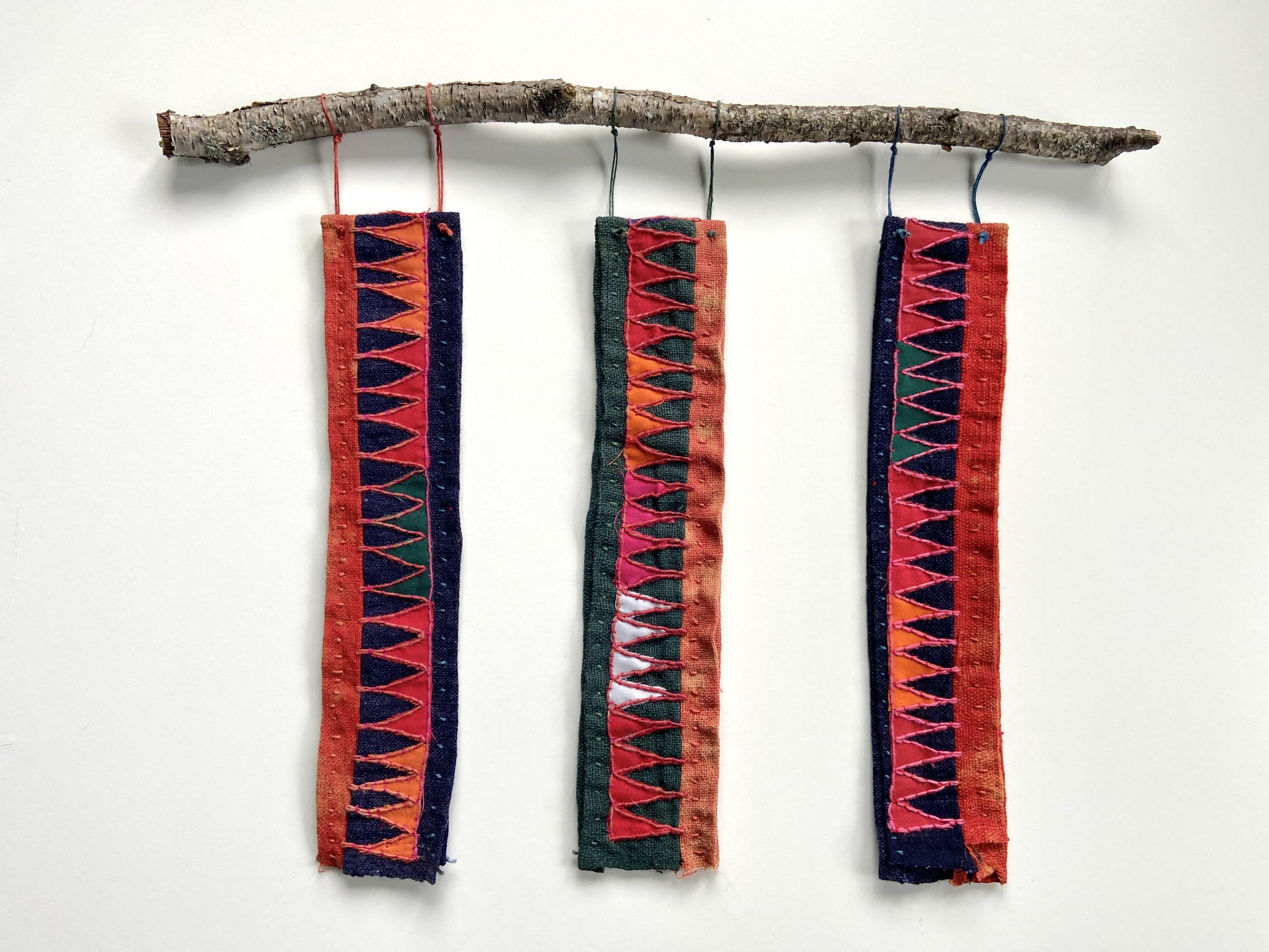 The Beauty of Sacred Reverence, mixed media fiber wall hanging made by Emma Freeman using an antique Peruvian embroidered cloth, slow hand stitching, hand embroidery and a gathered birch branch from my yard in Wisconsin. My art practice is my spiritu