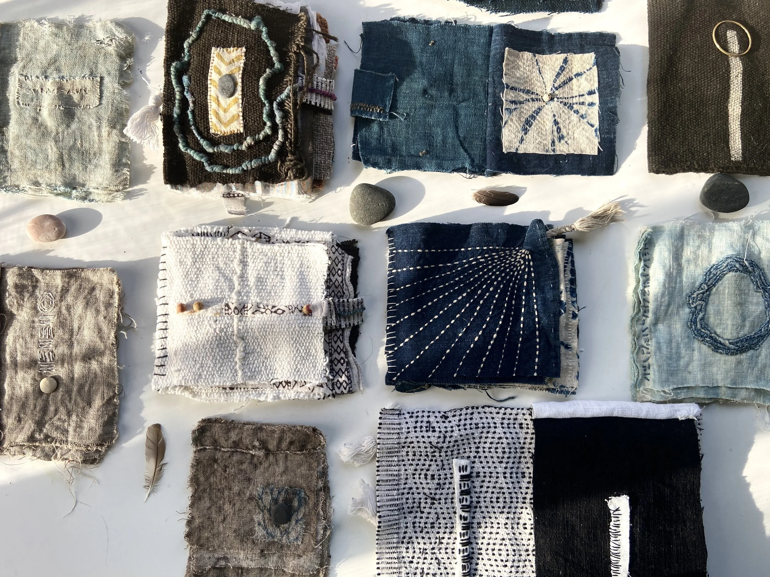 Rustic, wabi sabi, contemplative mixed media textile books made by mixed media artist, Emma Freeman using vintage global textiles including mud cloth from Mali in Africa, batik fabric from India, vintage kantha cloth from India, wool yarn from a Peru