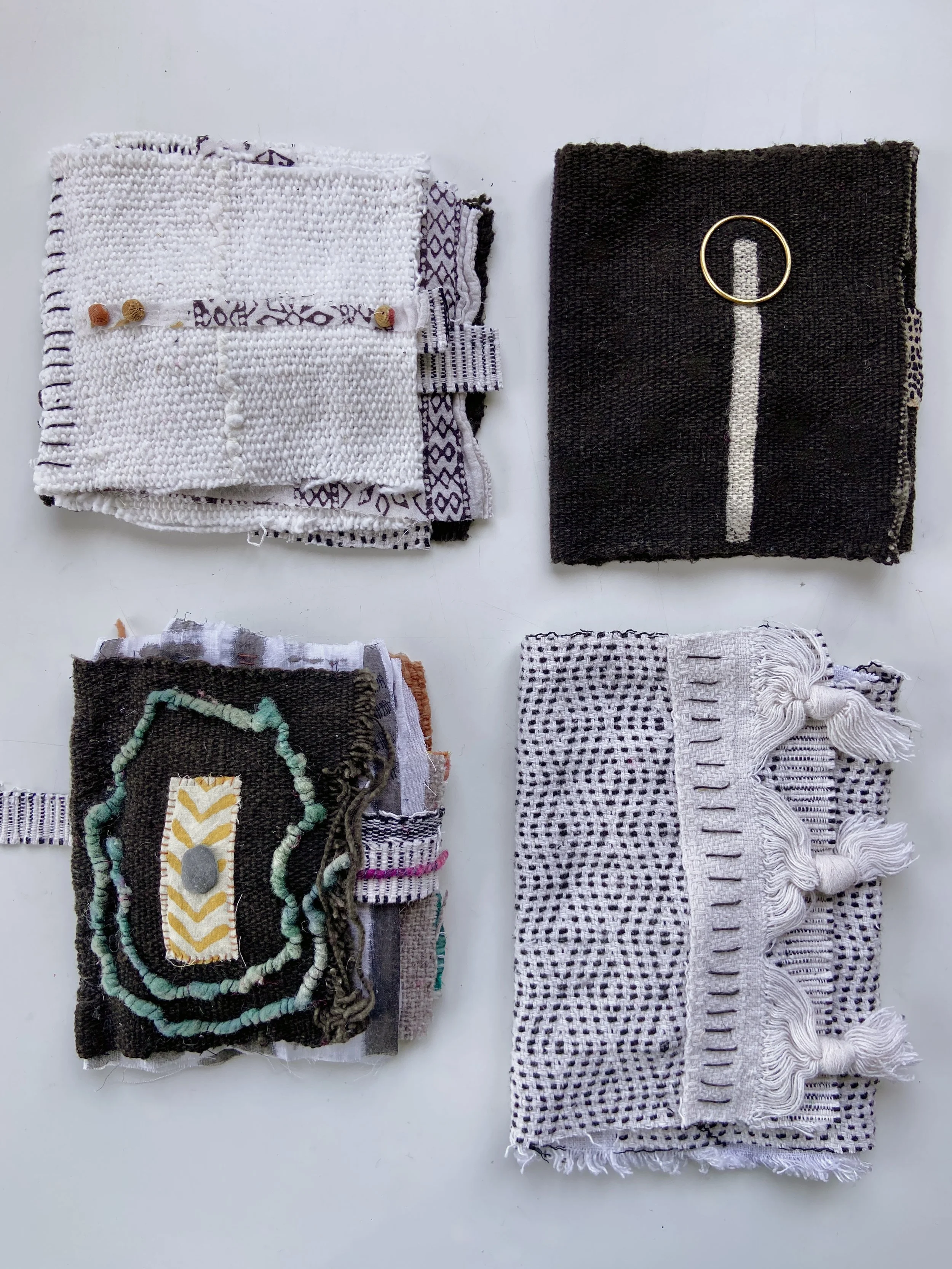Rustic, contemplative mixed media textile books made by mixed media artist, Emma Freeman using vintage global textiles including mud cloth from Mali in Africa, batik fabric from India, vintage kantha cloth from India, wool yarn from a Peruvian frazad
