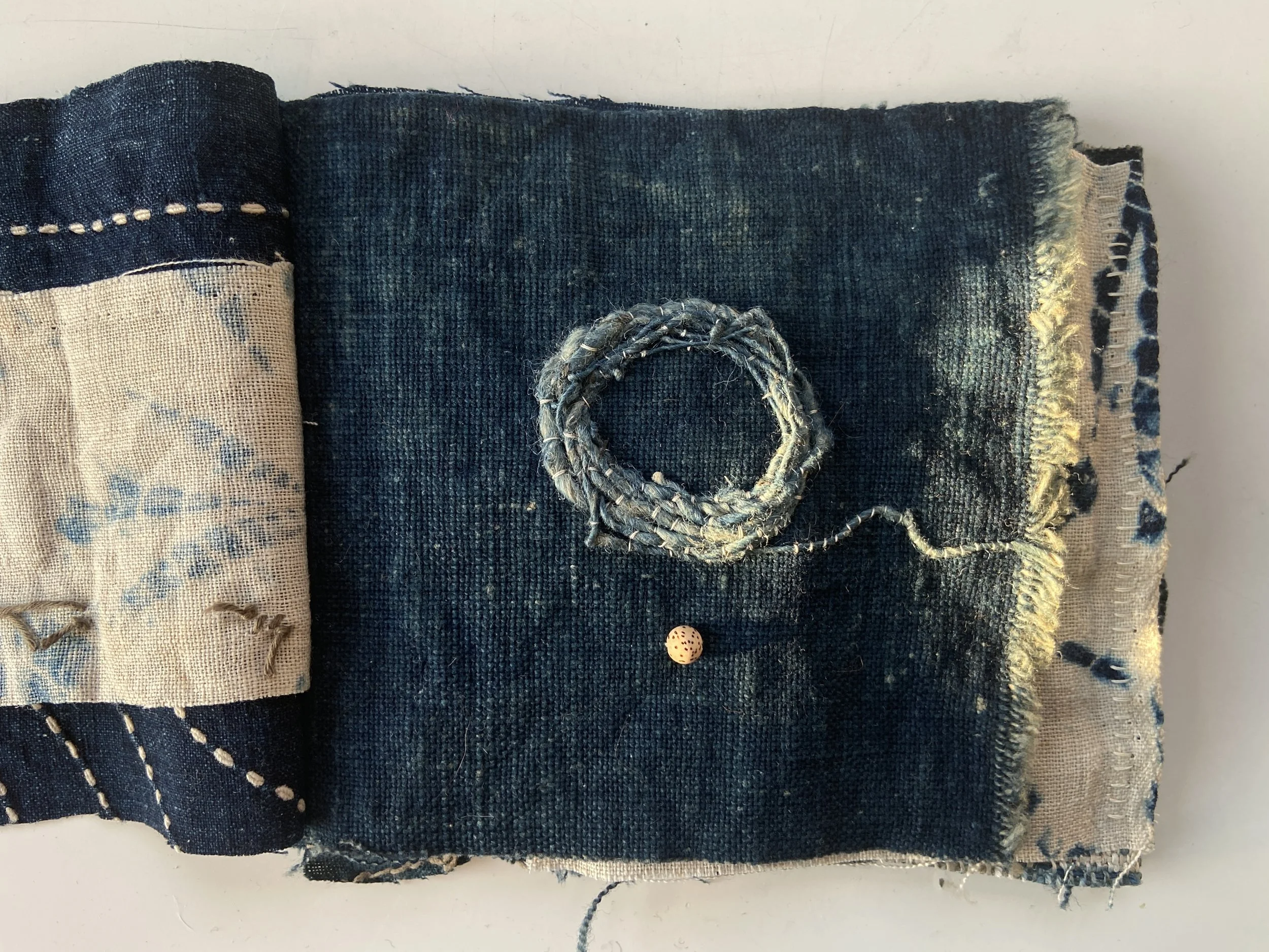 Rustic, wabi sabi mixed media textile books made by Emma Freeman using vintage textiles from Japan and China, naturally dyed fabrics, hand spun nettle yarn from India dyed with indigo, lotus seed meditation bead, and slow stitching by hand. 
