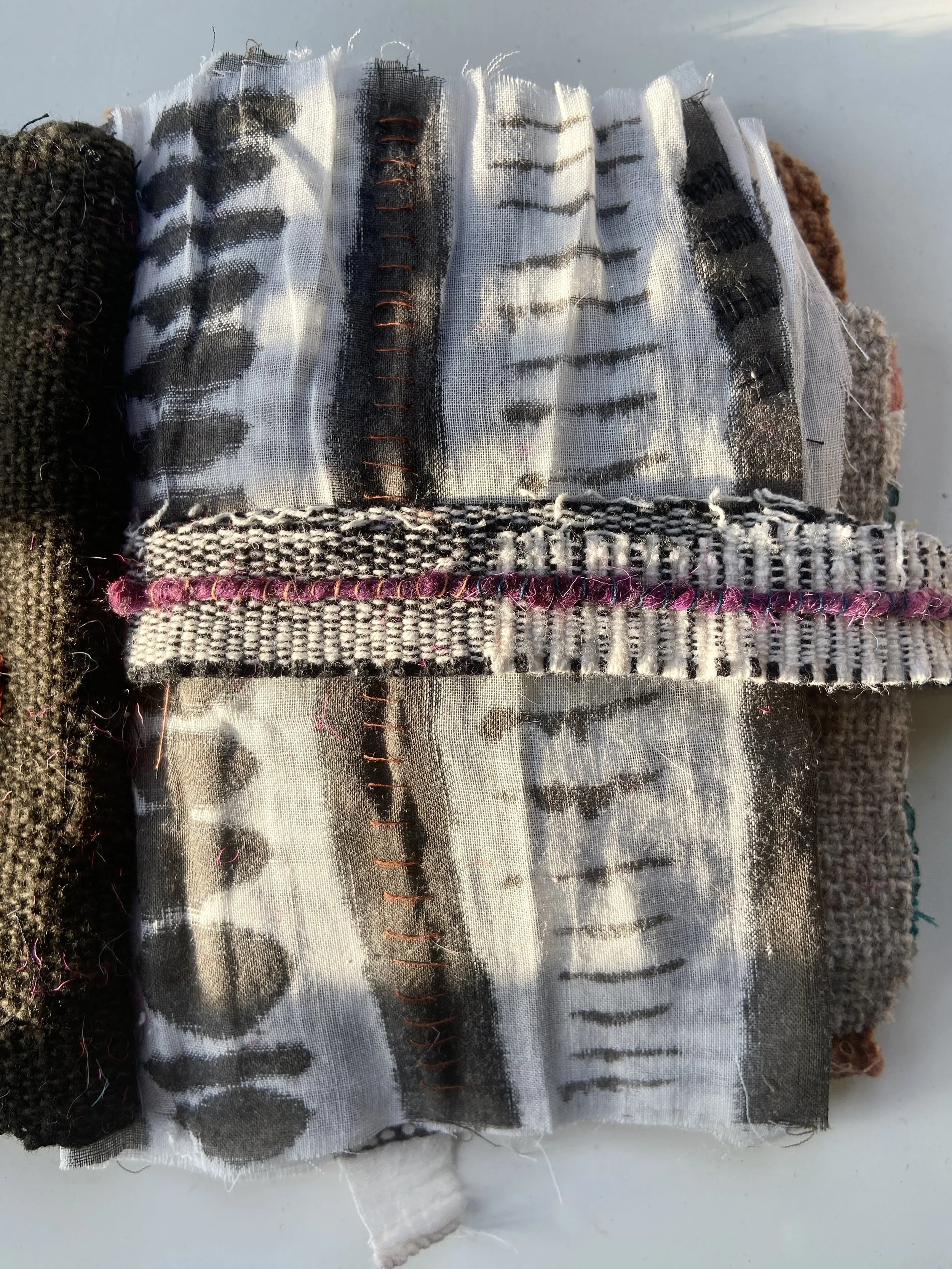 Rustic, contemplative mixed media textile books made by mixed media artist, Emma Freeman using vintage global textiles including mud cloth from Mali in Africa, batik fabric from India, vintage kantha cloth from India, wool yarn from a Peruvian frazad