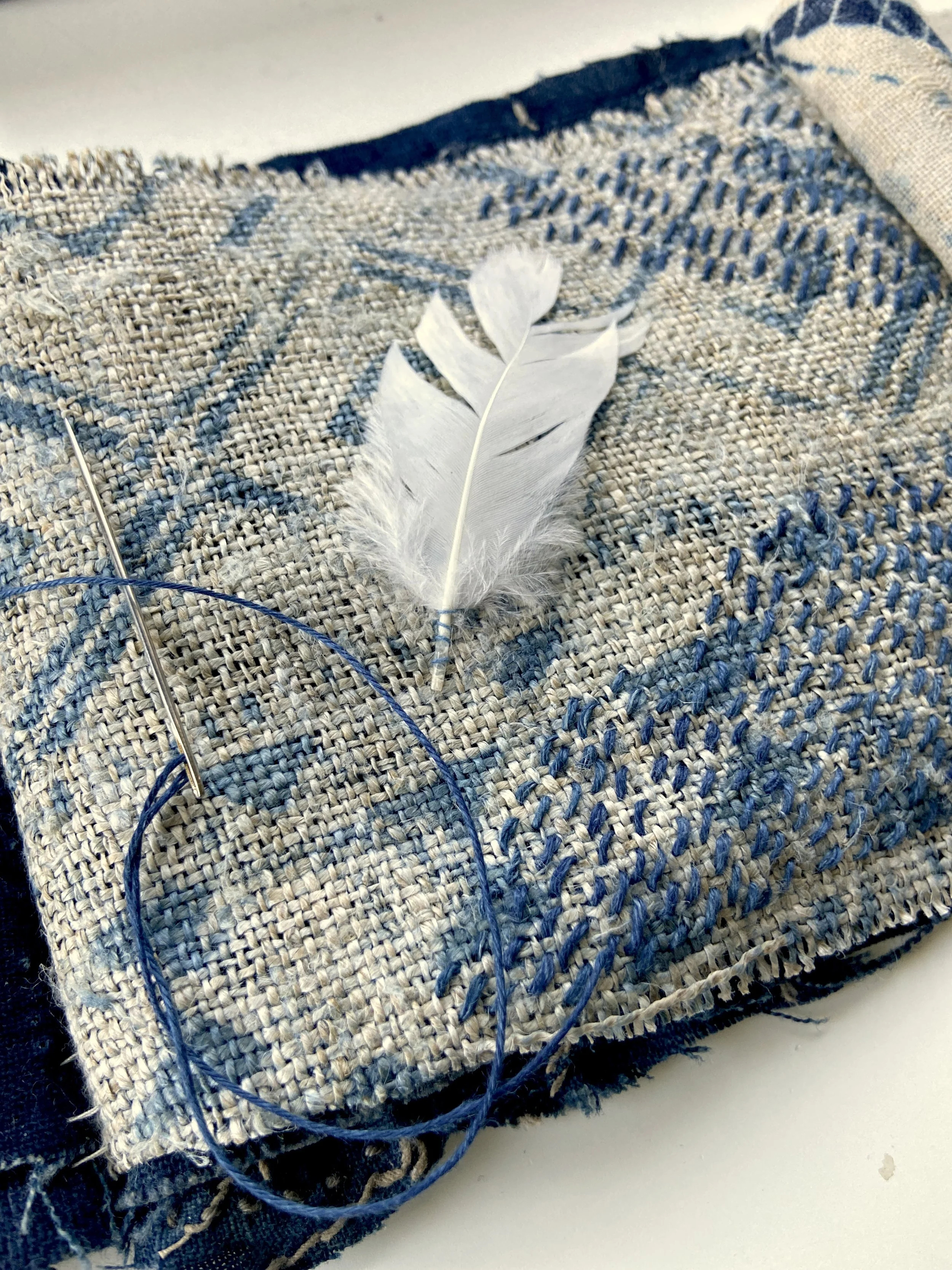 Rustic, wabi sabi, contemplative mixed media textile books made by mixed media artist, Emma Freeman using vintage global textiles including mud cloth from Mali in Africa, batik fabric from India, vintage kantha cloth from India, wool yarn from a Peru