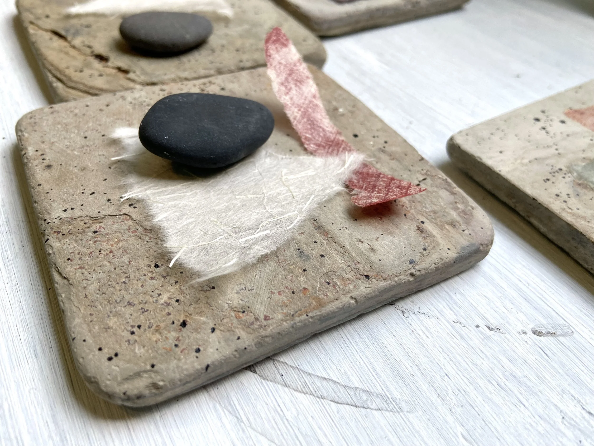 Zen contemplative assemblages of repurposed stone tiles, handmade paper, gathered stones, nature connected art, meditative art, contemplative art, peaceful art, mixed media artist in Wisconsin, Emma Freeman Art, textile artist, art as spiritual pract