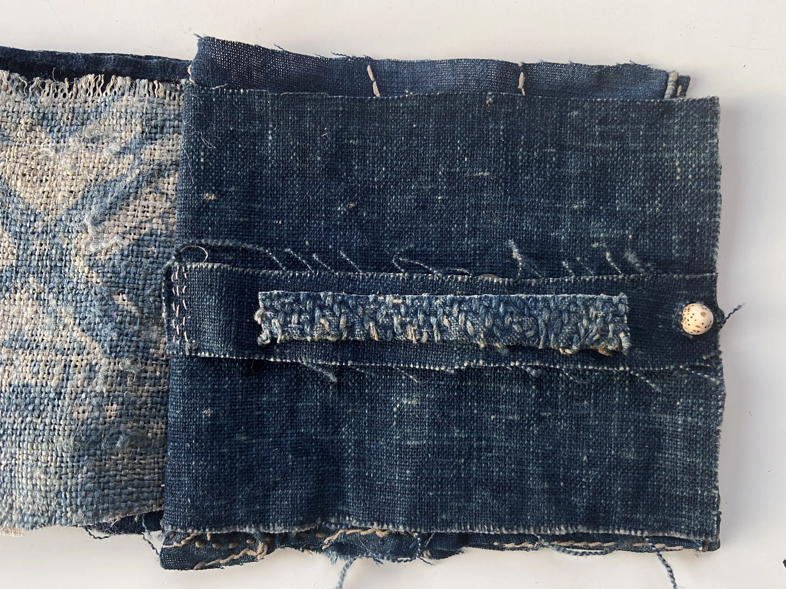 Rustic, wabi sabi mixed media textile books made by Emma Freeman using vintage textiles from Japan and China, naturally dyed fabrics, hand spun nettle yarn from India dyed with indigo, lotus seed meditation bead, and slow stitching by hand. 