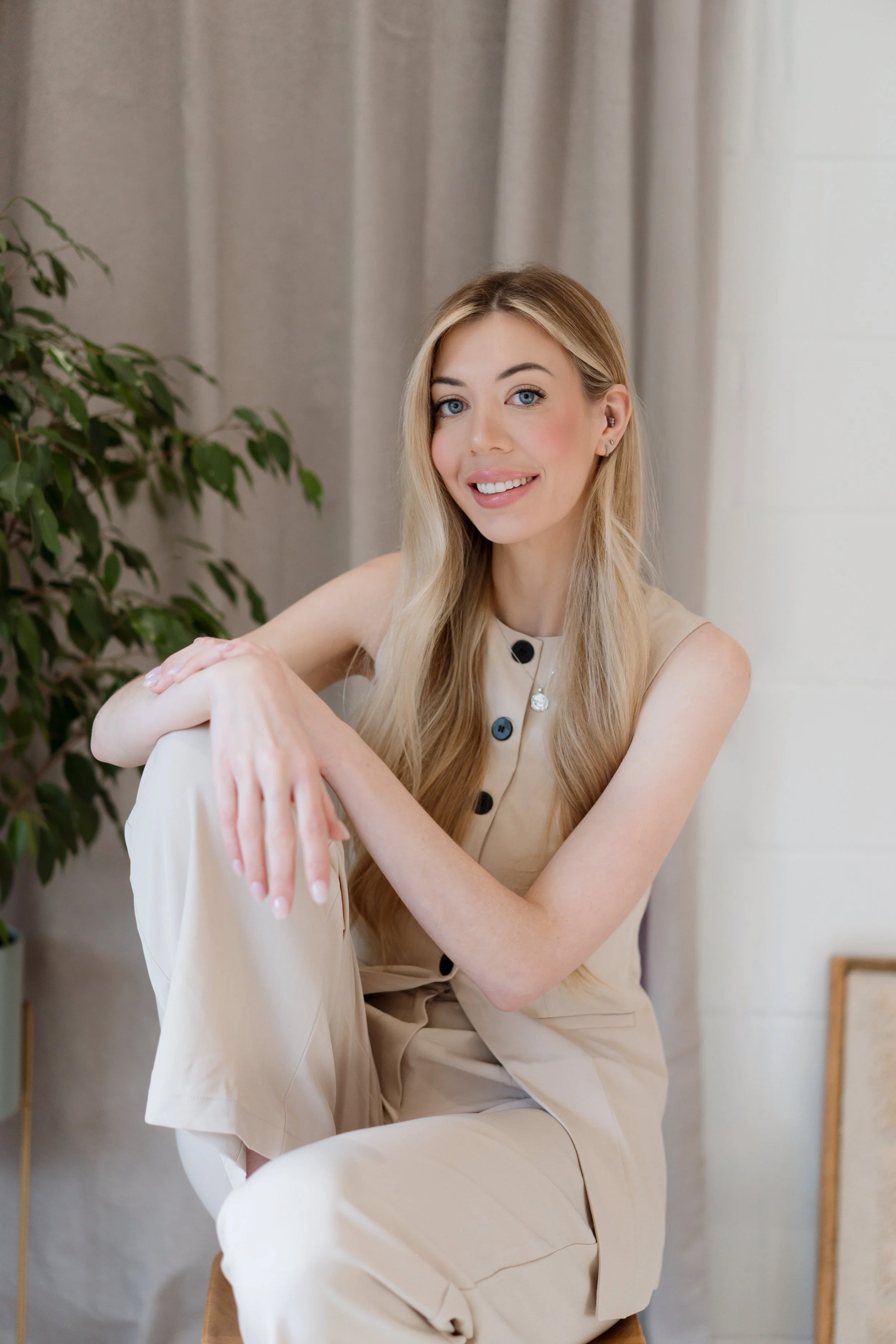 Personal brand photography by Photography by Trish - relaxed and natural portrait of a smiling woman in a bright, styled interior, Cambridge brand photographer, UK