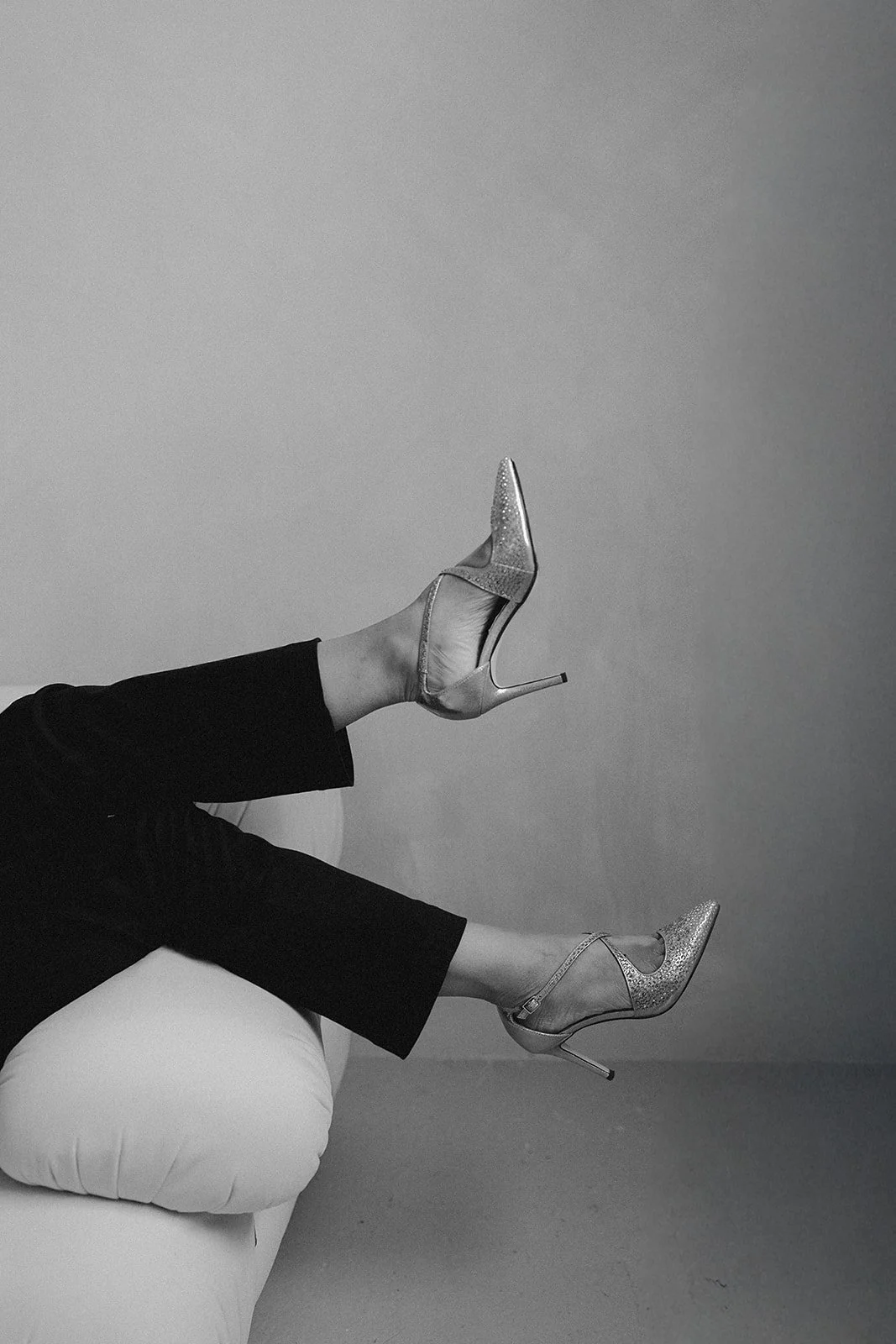 Black and white brand photography by Photography by Trish — woman relaxing in glittery heels, effortlessly styled personal brand session, Cambridge brand photographer, UK