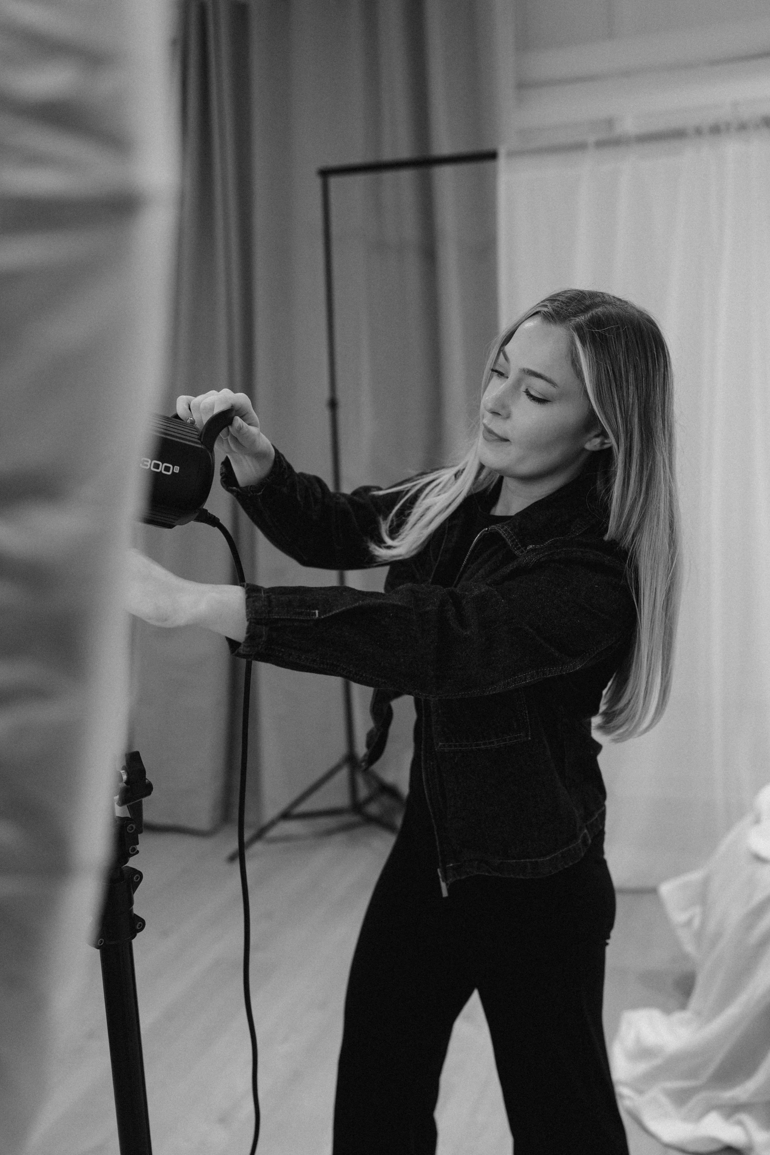 Behind the scenes brand photography by Photography by Trish - photographer setting up camera equipment in a studio, Cambridge brand photographer, UK