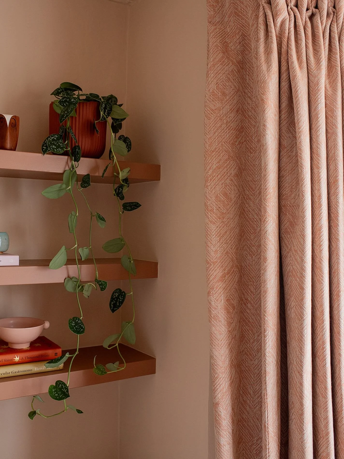 Want your bedroom to feel more inviting? In this Leyton bedroom, softness comes from the layers. Curtains add texture, gently frame the window and filter the light, planting brings a sense of life into the space, and a small curation of accessories a