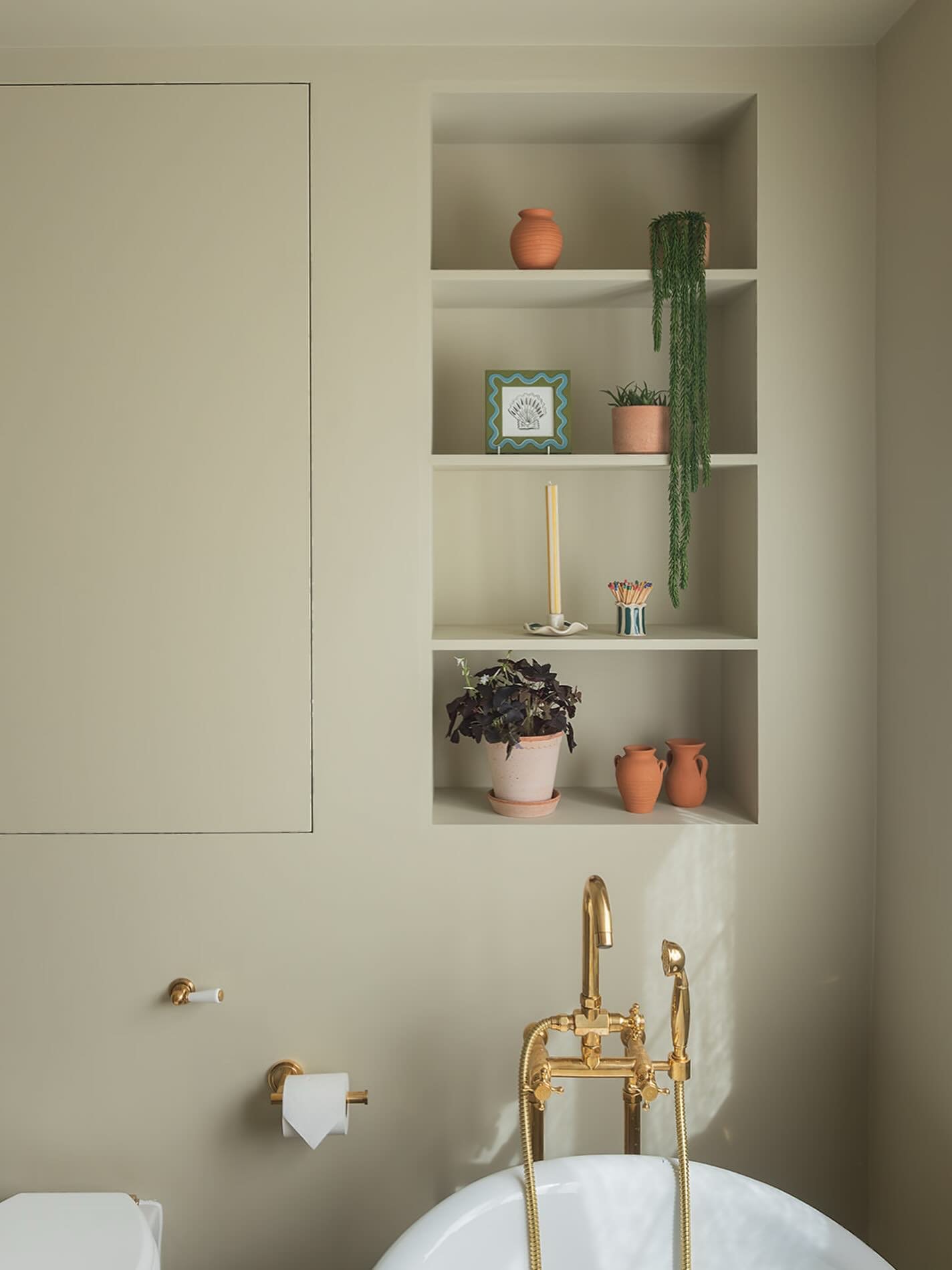 Storage was a big consideration in this bathroom. Behind the colour drenched walls, there&rsquo;s more going on than you might think. 

The panel to the left conceals a bespoke cupboard, and behind the loo we built out the wall to house the cistern a