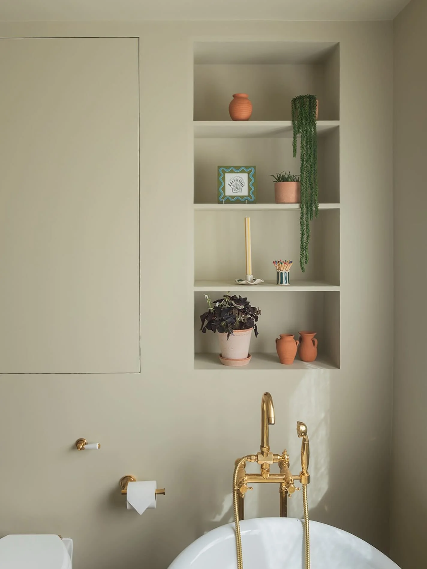 Storage was a big consideration in this bathroom. Behind the colour drenched walls, there&rsquo;s more going on than you might think. 

The panel to the left conceals a bespoke cupboard, and behind the loo we built out the wall to house the cistern a